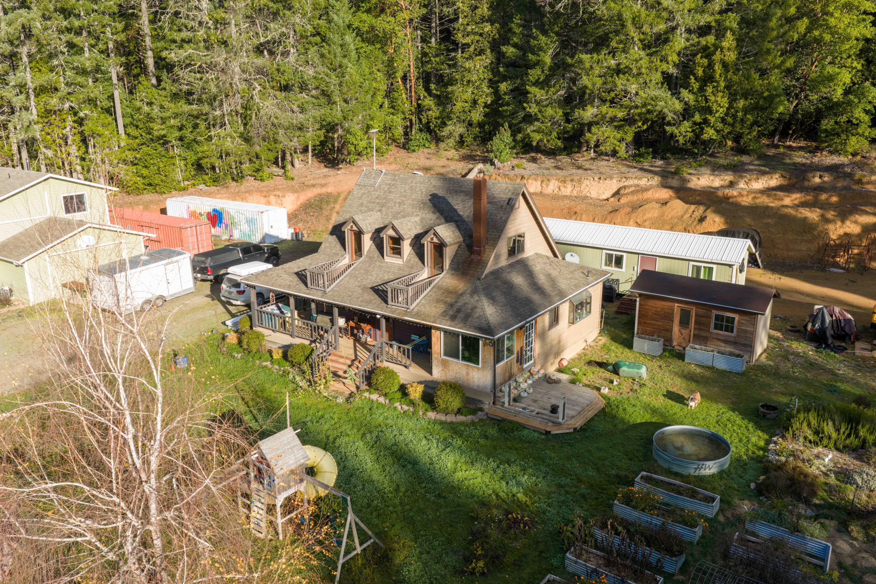 Beautiful property located minutes away from the picturesque Lake Selmac in gorgeous Southern Oregon. With two houses peacefully nestled amongst Oregon's natural beauty. Home # 1 boasts a farm-chic aesthetic with hardwood floors, ceder plank ceilings, cozy fireplace, custom butcher block island, attached solarium and all the amenities to fulfill your homesteading dreams.  Home #2 is nearly complete presenting you the opportunity to finish to your personal preference. Property offers a well-established garden, a shared gated entry, and plenty of space to fulfill your visions.  
A must see, don't miss out on this rare opportunity to own 159 acres of private oasis with 2 homes!  Priced to sell quickly.