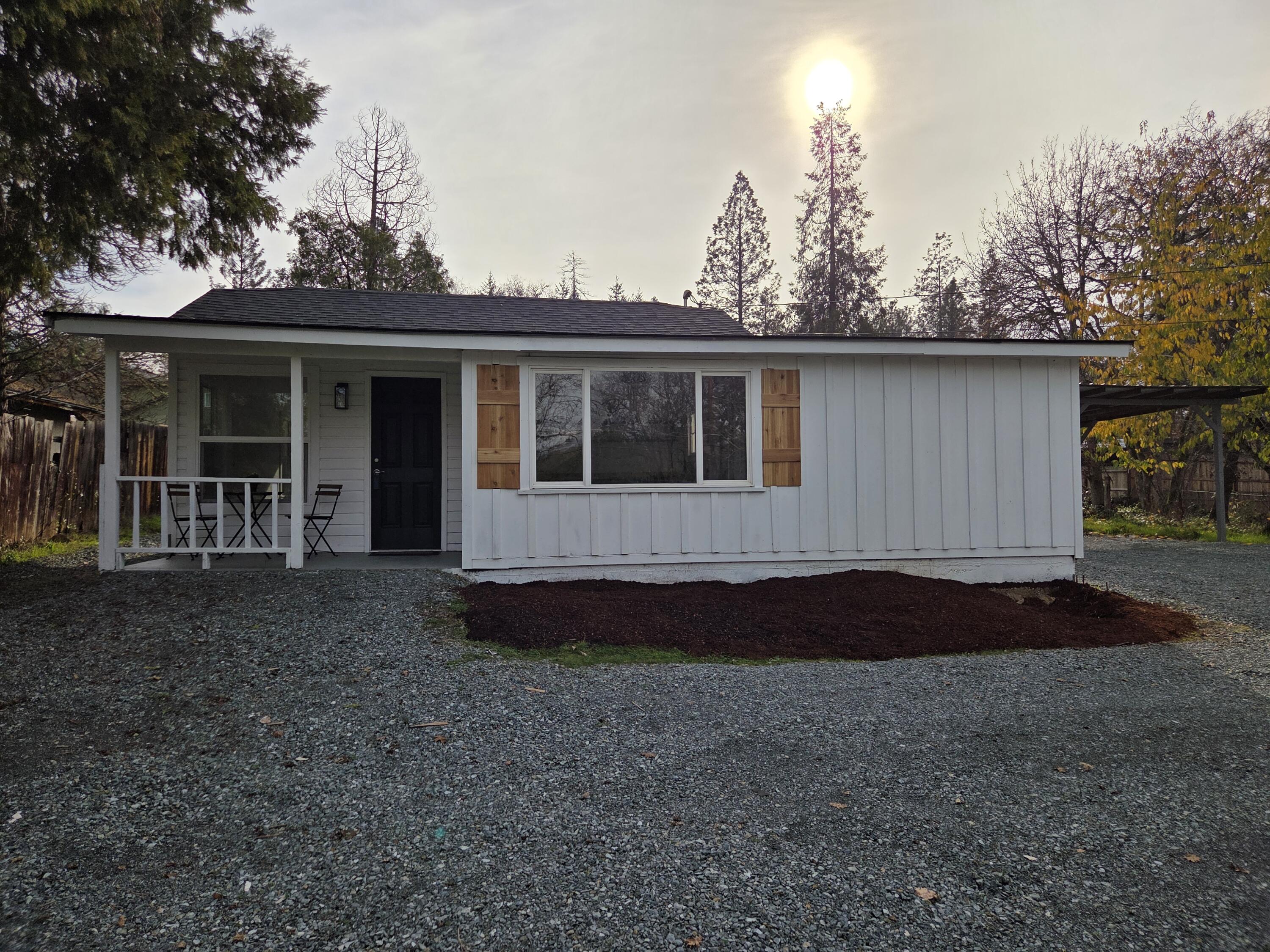This large .34 acre property on the perimeter of Grants Pass is fully fenced. The house has been recently remodeled with an all new kitchen, bathroom, flooring, paint, plumbing roof and fixtures. This 2 bedroom, one bathroom cottage is move in ready. Laundry room and additional storage or office room. Private well and septic for low utility bills.