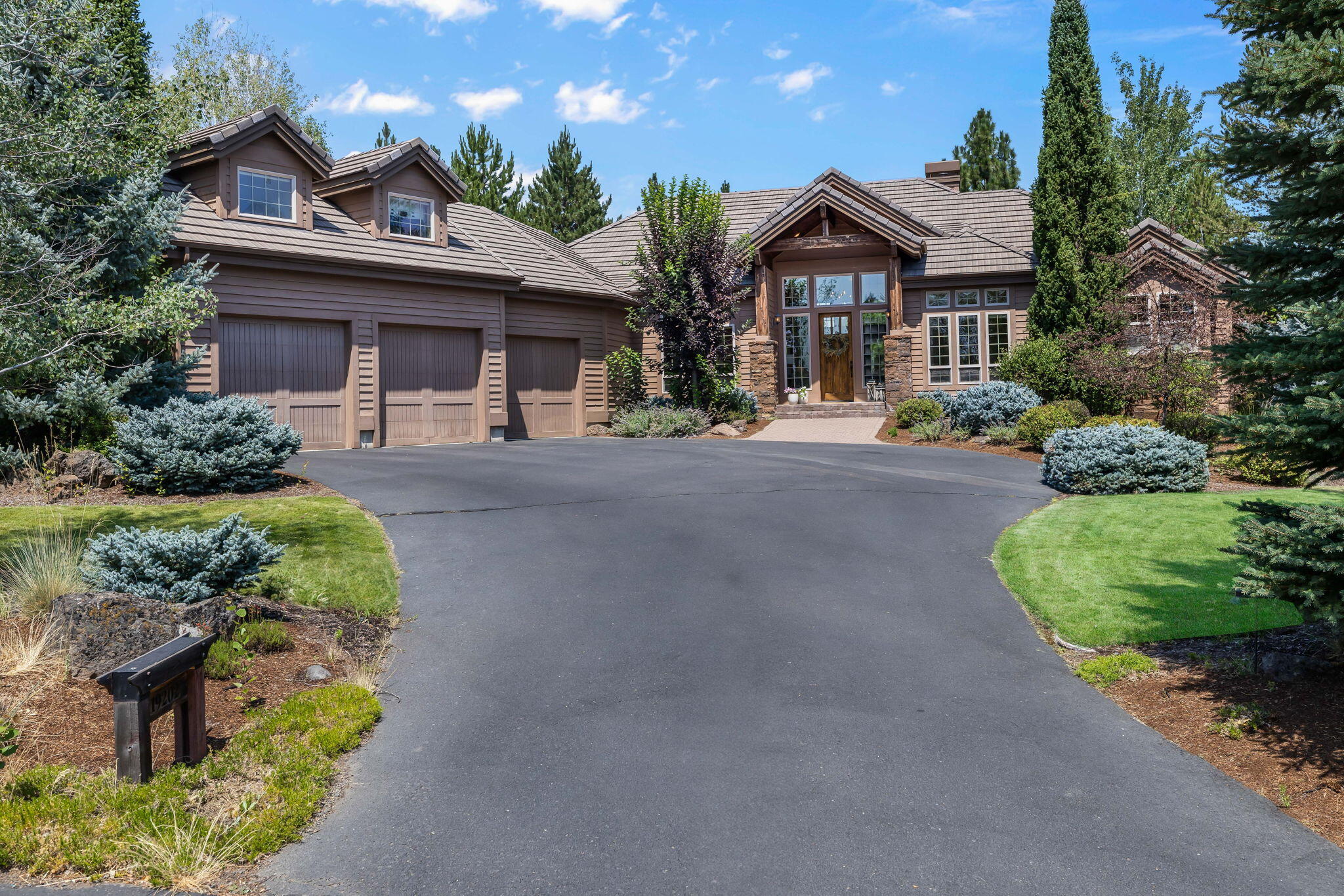 Nestled in the prestigious Broken Top golf course community on a .42 acre lot, this luxurious home has soaring vaulted ceilings with exposed wood beams throughout, hardwood floors, and an open floor plan perfectly designed for entertaining. The great room features a large wall of windows with sliding doors that flow into a beautifully landscaped yard that is an entertainer's dream, perfect for outdoor dining, gathering around the cozy firepit or just relaxing to the backdrop of the 12th green. Inside, discover a gourmet kitchen with a large dining area, three spacious ensuite bedrooms, a vaulted dedicated office and versatile bonus room above the 3 car garage. Through membership at Broken Top you can enjoy exclusive access to amenities: a luxurious pool, fine dining, tennis courts, and of course, the Broken Top golf course. Explore nearby shops, restaurants, and bike trails, or hit the slopes at Mount Bachelor for skiing.
Don't miss your opportunity to own this beautiful Bend home