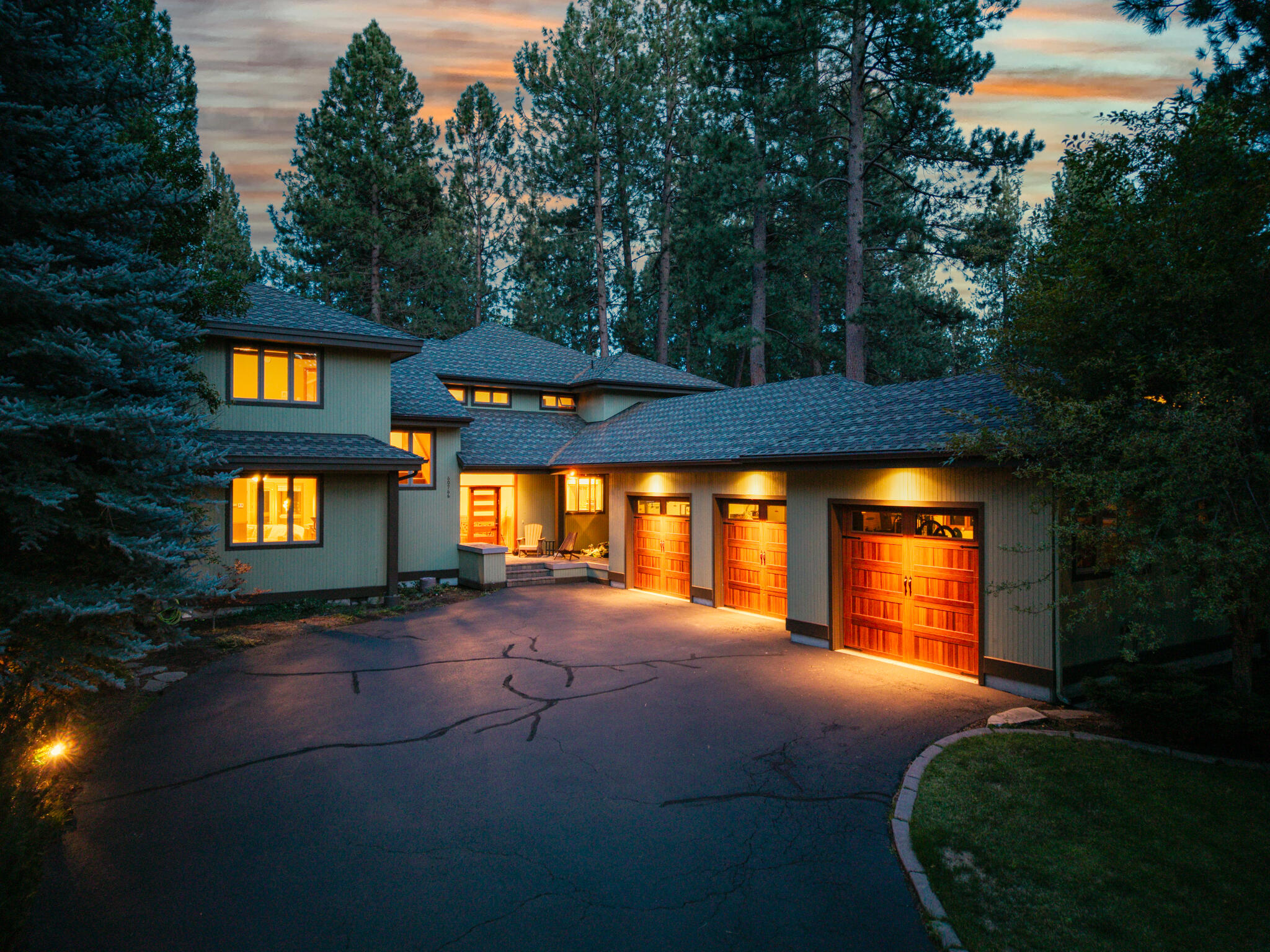 In the heart of the coveted Widgi Creek neighborhood, this 4,023 sq ft Northwest-style retreat offers 4 bedrooms and 4 bathrooms wrapped in warmth and style. Vaulted cedar ceilings, rich wood beams, and hardwood floors set the tone for inviting living spaces, while a chef's kitchen with Brazilian granite island, custom cabinetry, and premium black stainless appliances inspires culinary creativity. Gather by the floor-to-ceiling stone fireplace or relax in the private hot tub, perfect for entertaining under the pines. Just five minutes from downtown Bend, yet tucked into the serene Deschutes National Forest, this home is surrounded by mountain biking and hiking trails and sits only steps from the Deschutes River. Featuring a spacious three-car garage to keep all your outdoor and adventure gear, this is the ultimate adventure hub house — blending natural beauty with modern comfort, minutes from golf, pickleball, trails, and Mt. Bachelor.