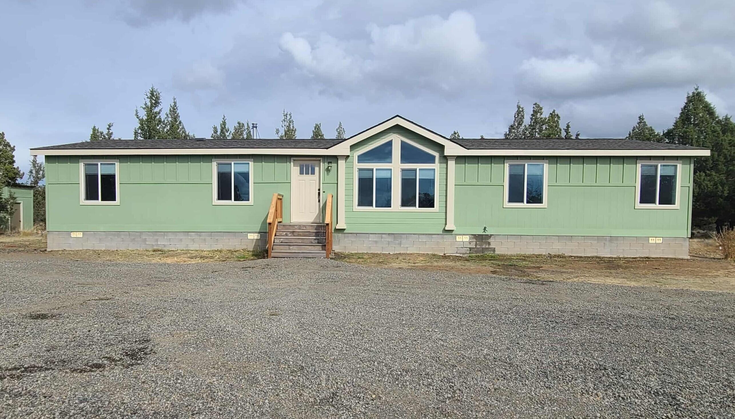 You can enjoy peace and privacy on this 10-acrea property, comprised of two 5-acre tax lots, featuring a spacious 1,836 sq. ft. manufactured home with 4 bedrooms and 2 full baths. The home offers fresh paint, a wood stove, and plenty of room for comfortable living. Outside, you will find a back deck, chicken coop, two storage containers, and a private well. Native trees and plants create a natural, serene setting with lots of space for recreation or future development. Quiet and private, this property is a perfect retreat with
room to grow.