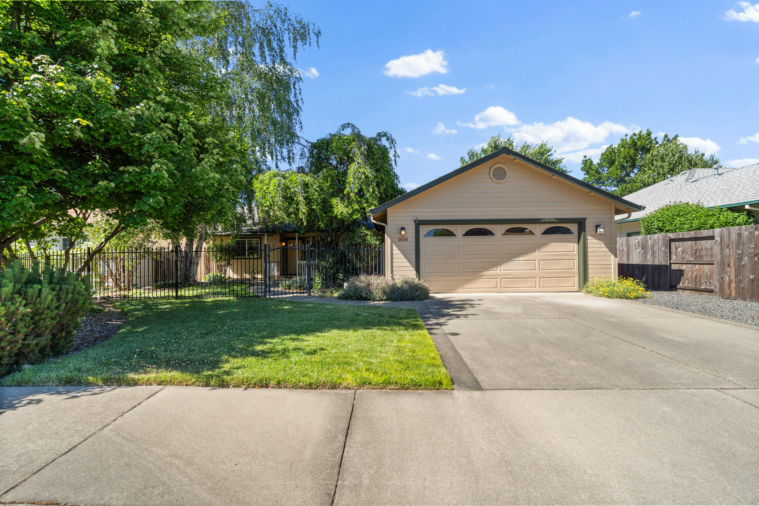 Welcome to this beautifully maintained 3-bedroom, 2-bath home nestled in the peaceful and sought-after Wagner Meadows neighborhood. This home features a desirable split floor plan providing added privacy to the spacious master suite. Enjoy a large and inviting living room with vaulted ceilings, a formal dining, and a well-appointed kitchen with tile countertops, pantry and ample cabinet space and convenient laundry room. Outside you'll find a cozy back patio with a hot tub and gazebo, and fully fenced-in yards with included sprinkler system. Located just minutes from downtown & shopping yet tucked away from city noise. Don't miss this wonderful opportunity—schedule your private showing today!