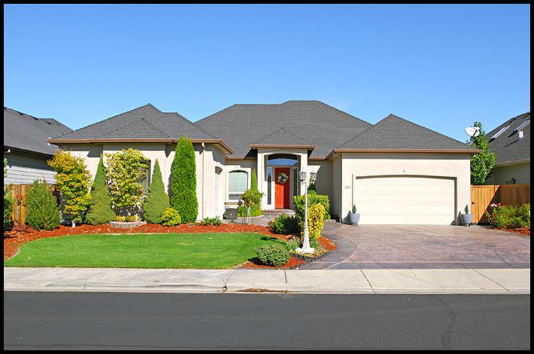 Simply impeccable care has gone into this gorgeous single level home within the Eagle Point Golf Community. Sparkling clean and move in ready, this 4 bedroom, 2 and a half bath beauty shows perfectly. The exterior is manicured to the nines. The open floor plan is evident as you walk through the front entry. Lot's of room in this home. The master is beautiful with an oversized walk in shower to die for, jetted tub of course, dual sinks, very well appointed, with huge walk in closet. Attached 2 car garage, with an addition 1 car garage or work shop. Formal dining, beautiful pillars, high ceilings. Lots of extras including invisible screen doors, up lighting and built ins, gas plumbed BBQ stays. There is a gardening shed included. Concrete walk all around the home. The kitchen is fantastic and the center of the living area, including a gas grill with downdraft, built in oven and microwave, attractive backsplash, pantry, the works! Laundry is well located and includes a deep sink. Must See