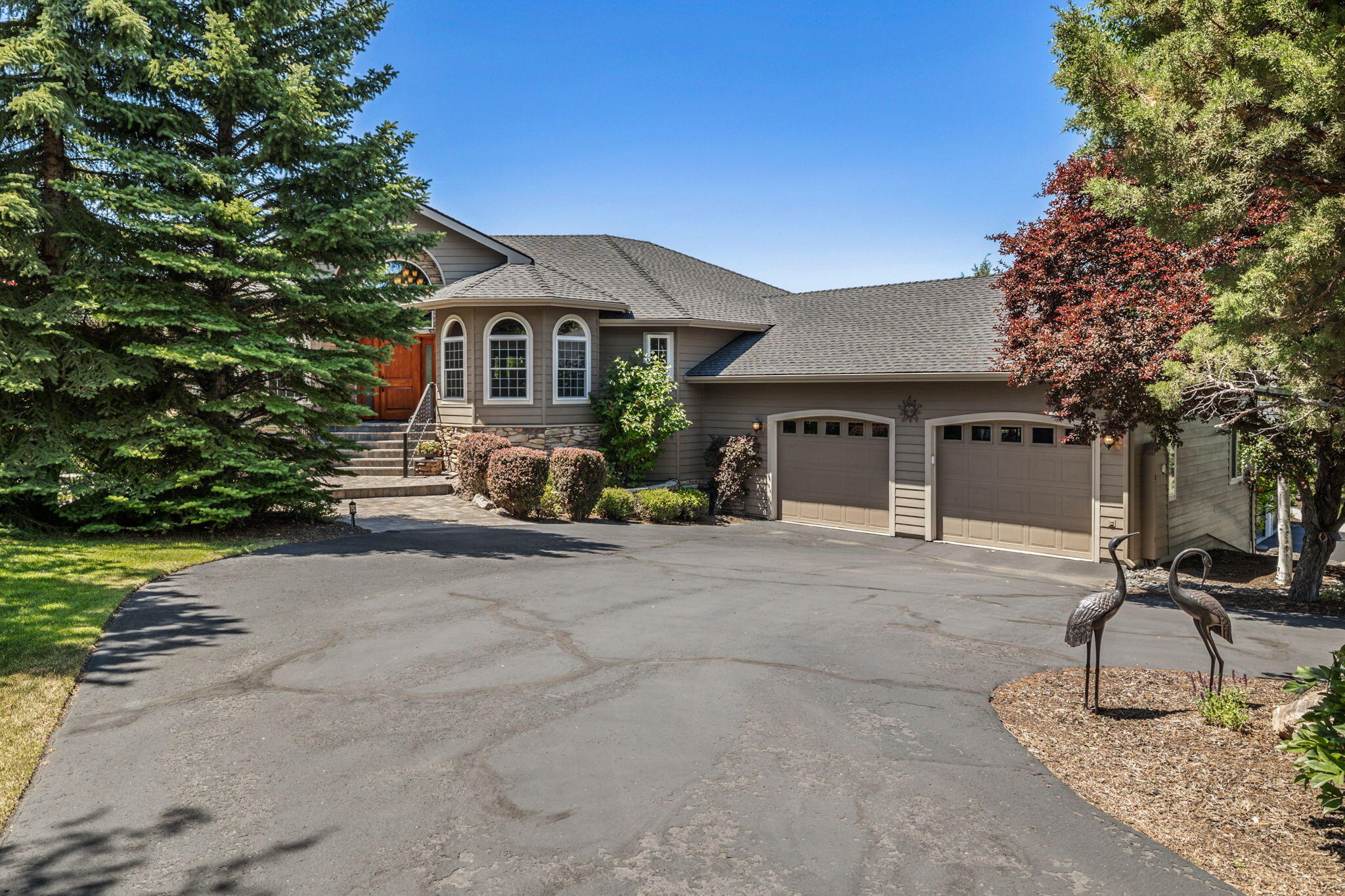 Welcome to the epitome of luxury living in the Eagle Crest Golf community! This home offers a perfect blend of elegance, comfort, and breathtaking Cascade mountain views. With 4 bedrooms, 2 and a half baths, and an array of outstanding features, this residence will exceed your expectations. Upon entering, you'll be captivated by the grandeur of the main floor. The gourmet kitchen is a chef's dream, featuring a large center island, abundant cabinetry, and top-of-line appliances. Downstairs, you'll discover a world of entertainment possibilities. 3 spacious bedrooms offer a retreat for family and guests, while the entertainment center and wet bar provide the ideal setting for hosting unforgettable gatherings. Wine enthusiasts will appreciate the nicely designed wine cellar, perfect for storing and showcasing their prized collection. Enjoy the views from the heated two-story covered deck which overlooks the third fairway of the Ridge Golf Course. Come experience this exceptional home!