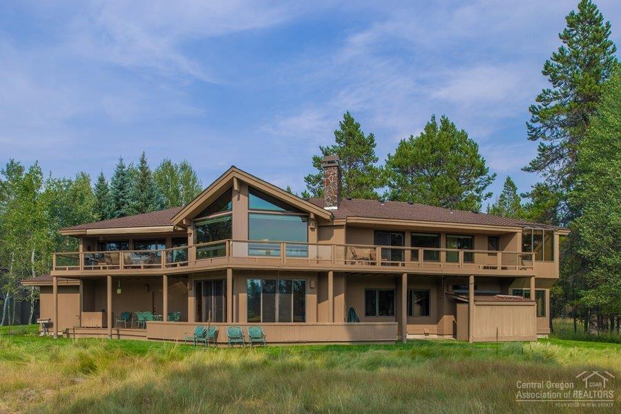 This large 5 bedroom / 5.5 bath home offers 4,734 sq ft of sheer bliss! Located on 1.5 lots in a quiet River Village location. Partial river and mountain views. Awesome plan with loads of bedrooms and an entertainer's dream! Over $300,000 in updates in past 10 years! 2 fireplaces, granite counters, extensive wood flooring, 3 car garage, 2 living areas, large outdoor hot tub.
