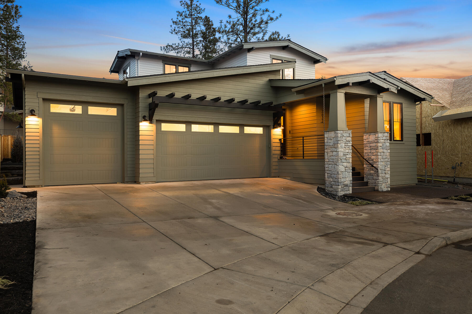 A must-see Craftsman stunner by MCD Homes, located on a cul-de-sac in Talline, one of Bend's premier communities featuring oversized lots & easy access to schools, Shevlin Park, Phil's Trail & more! Relax in a spacious great room engulfed by windows & natural light. A nearby chef's kitchen boasts a large island ideal for meal prep, floor to ceiling cabinets, & JennAir appliances. Step out the great room to a charming paver patio ideal for outdoor dining & entertainment. The main-level primary offers a luxurious primary bath & private courtyard, perfect for a hot tub or sauna. An additional main-level bedroom (or office) w/ a full bath doubles as a guest suite. Upstairs, find two bedrooms, a full bath, & a bonus space for guests to unwind.  Lush landscaping and lush pines offer a place to relax during summer afternoons. A two-car garage w/ storage & 3rd bay w/10 ft door are ideal for oversized vehicles & all your gear. An outstanding home in a cherished location awaits!