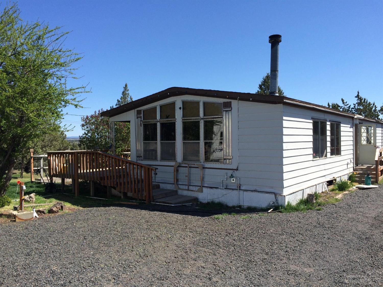 Affordable 3 bedroom 2 bath home in Crooked River Ranch. This property sits high on the rim overlooking the park. Views of the Crooked River Ranch canyon. Located on a paved street. This would be an ideal property for a person looking to build their dream home while living in the current house.