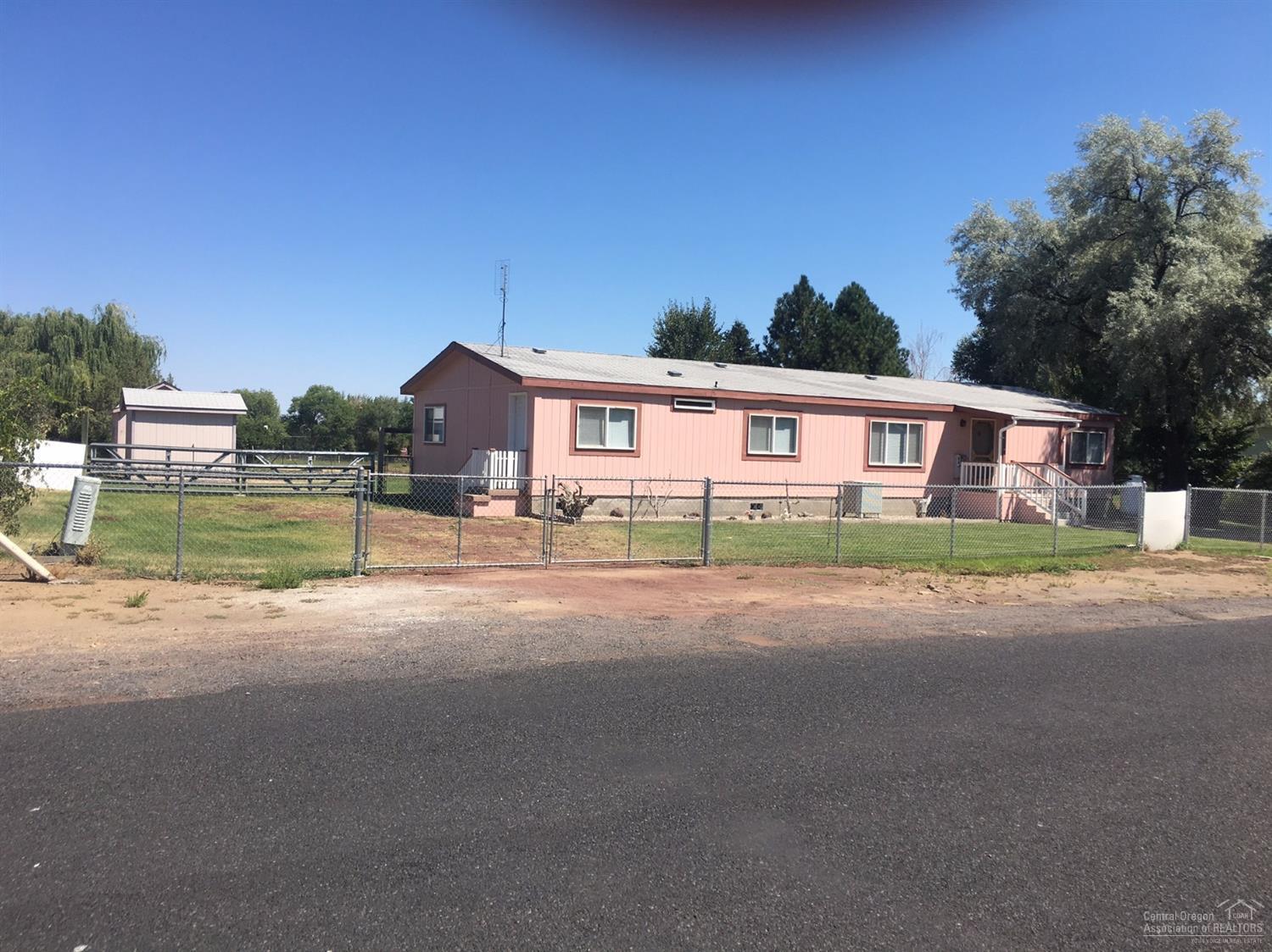 Sale failed...Back on market...Great neighborhood, nice location to shopping and schools. Home has 1782 sq ft with 5 bedrooms and 2 baths all on .42 acres. Two extra outbuildings with concrete floors and power. RV area and parking. Fenced yard and garden area with greenhouse. Home has heat pump for great relief on these 100 degree days. Community water is $240 per year.