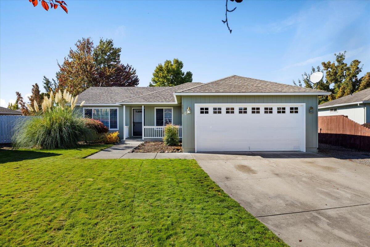 Discover this well-maintained 3 bedroom 2 bath home in a tucked away neighborhood. Step into a really nice floorplan with custom tile flooring entry and vaulted ceilings in the main living room. The kitchen shines with extensive oak cabinetry and dining area, while the spacious primary suite features a generous walk-in closet. Comfort comes standard with natural gas heat and central air. Built-ins throughout maximize storage and functionality. The thoughtfully placed laundry room offers additional cabinetry for organization. Enjoy breathtaking views of Mt. McLoughlin from the front yard. The finished and insulated garage is fantastic for tinkering away. Outside there is a 12' x 60' RV parking area, and a 20' x 10' storage shed. Relax on the covered patio in your fenced back yard while the in-ground sprinkler systems maintain your landscaping. This adorable property presents the perfect blend of comfort, convenience, and curb appeal. Ready for immediate occupancy!