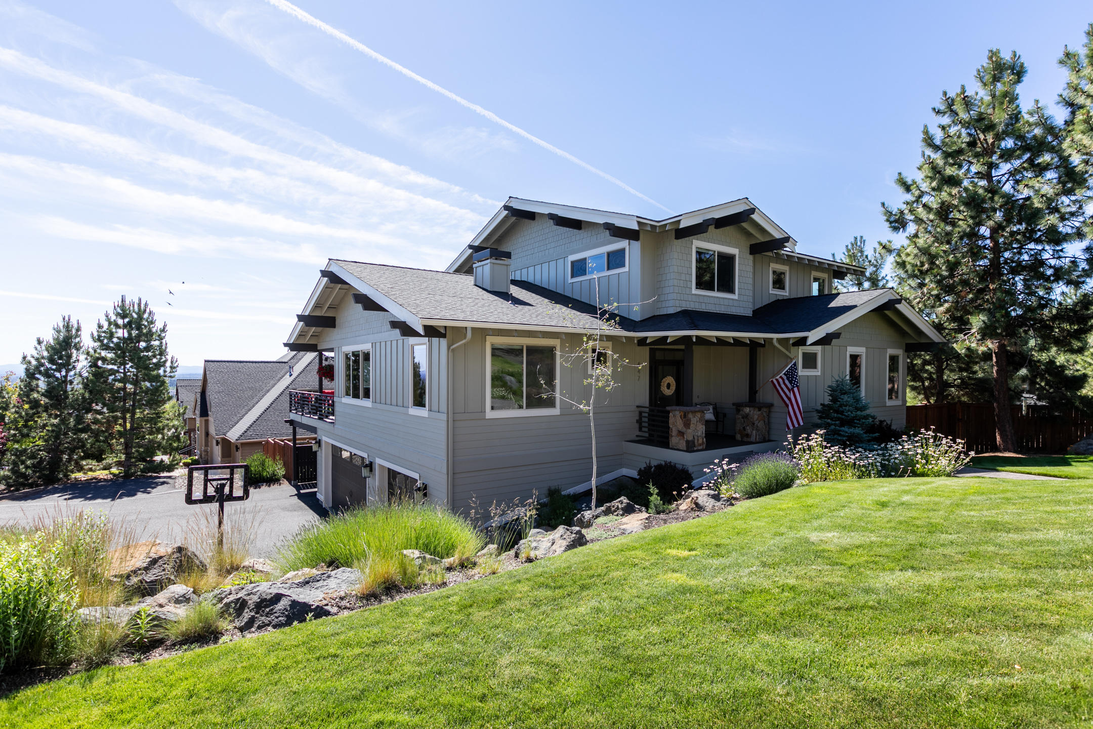 This luxury 3,460 sq ft Contemporary Craftsman w/transitional styling creates a distinctive home w/fine, yet functional finishes. It is perched in a cozy, idyllic neighborhood overlooking views of the city and Ochocos from most rms. This home sits less than a mile from the River Trail and downtown. Enjoy main level living w/master, gt room, office, powder and laundry. You'll find 3 generously sized bedrms upstairs.  The bottom floor - walk in from the garage - acts as a fabulous bonus rm or a guest rm with full bath. Kitchen features an oversized eating island, pantry, higher end appliances and expansive views. Master includes prvt deck access, and bath features soaking tub, and large w/in shower. Oversized 3 bay garage boasts 1000 +/- sq feet of finished storage for all your C.O gear. Home offers covered pkng for a boat/RV including an RV electrical outlet. Watch the fireworks from your deck-see the sunrise every morning with your coffee. Sit in the hot tub and watch the city lights.