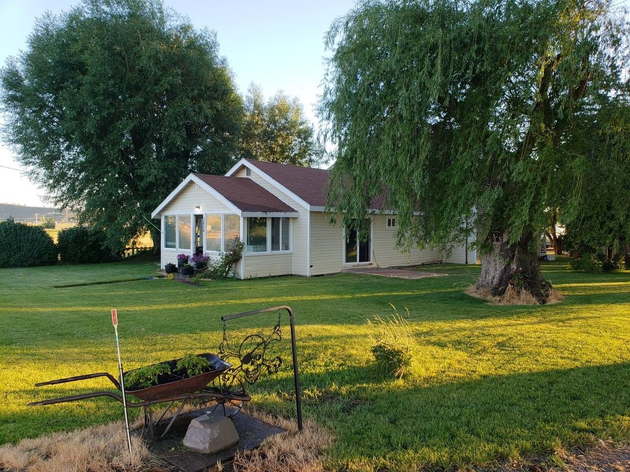 Nice home on one acre in Bonanza! Featuring 4 bedrooms, 2 bathrooms, family and living room with updated kitchen cabinets and counters. New forced air furnace about 2 years old and newer gas water heater, plus 18 new vinyl windows. Master is on the main level with large walk in closet, additional bedrooms are upstairs and all good size. Finished and enclosed front porch with large windows. Wood stove in the family room with a gas stove in the living room. Covered patio off the living with fenced in yard. Detached 2 car garage with workbenches and office space.Full price offers only!
