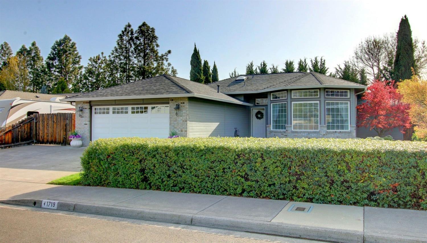 This Home is Absolutely MINT! What an amazing, well cared-for home located in a quiet & peaceful neighborhood in SW Medford. Beautiful, large front & back yards w/timed sprinklers, mature landscaping & plenty of space to enjoy gardening. Gorgeous tile entry, huge 10 foot ceilings in living room w/large bay windows. Shows elegance of the details throughout. Custom wood trim treatments throughout the home, brushed nickel hardware & lighting, enormous kitchen flows nicely w/extra cabinets, plenty of counter space & storage, newer stainless-steel appliances, large laundry room & more. Kitchen opens to the dining room which has a slider to the beautiful back yard. Shows immaculately inside & out. Key features include: newer furnace, newer AC Unit, newer water heater, 6-year old roof, extra wide driveway w/extra concreted side parking for a trailer/boat. Skylights, hot-tub hook-up, 2-car garage w/shelving, coffered ceilings, must tour. You won't be disappointed in this home!