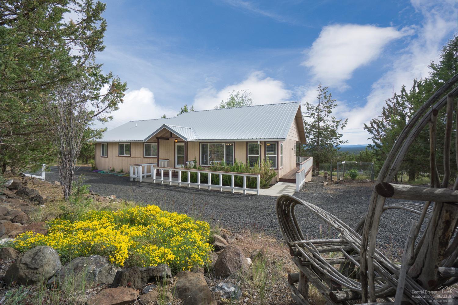 Move-in Ready Home on almost 2 acres! Fantastic North Easterly views of the Ochocos & foothills of Grizzly Mountain. This 3bd/2ba home has an open living area and oversized kitchen with plenty of cabinet space. Large bedrooms & master with dbl vanity and soaking tub! Back slider opens up to expansive covered back deck to enjoy the views! Detached garage/shop w/a full bath and loft area. Multiple outbuildings for extra storage. Plenty of room for RV parking and other toys. A must see!