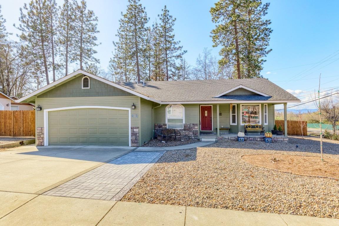 Location is king with this lovingly cared for 3 bed, 2 bath home. Located across the road from the Eagle Point Golf Course with views of the 13th fairway this home also offers an abundance of RV parking capable of handling a 50' RV. The home has been updated with new laminate floors, stainless appliances and a new covered patio out back. Enjoy vaulted ceilings in the living areas and master bedroom, and bay windows in the living and dining areas. The kitchen boasts an island, granite counters and gas range as well as an abundance of cabinets. Spend more time golfing and less time on the yard with the low maintenance front yard. The home also features two large storage sheds. Spend leisure evenings walking the path along the golf course and enjoying the wonderful community of Eagle Point.