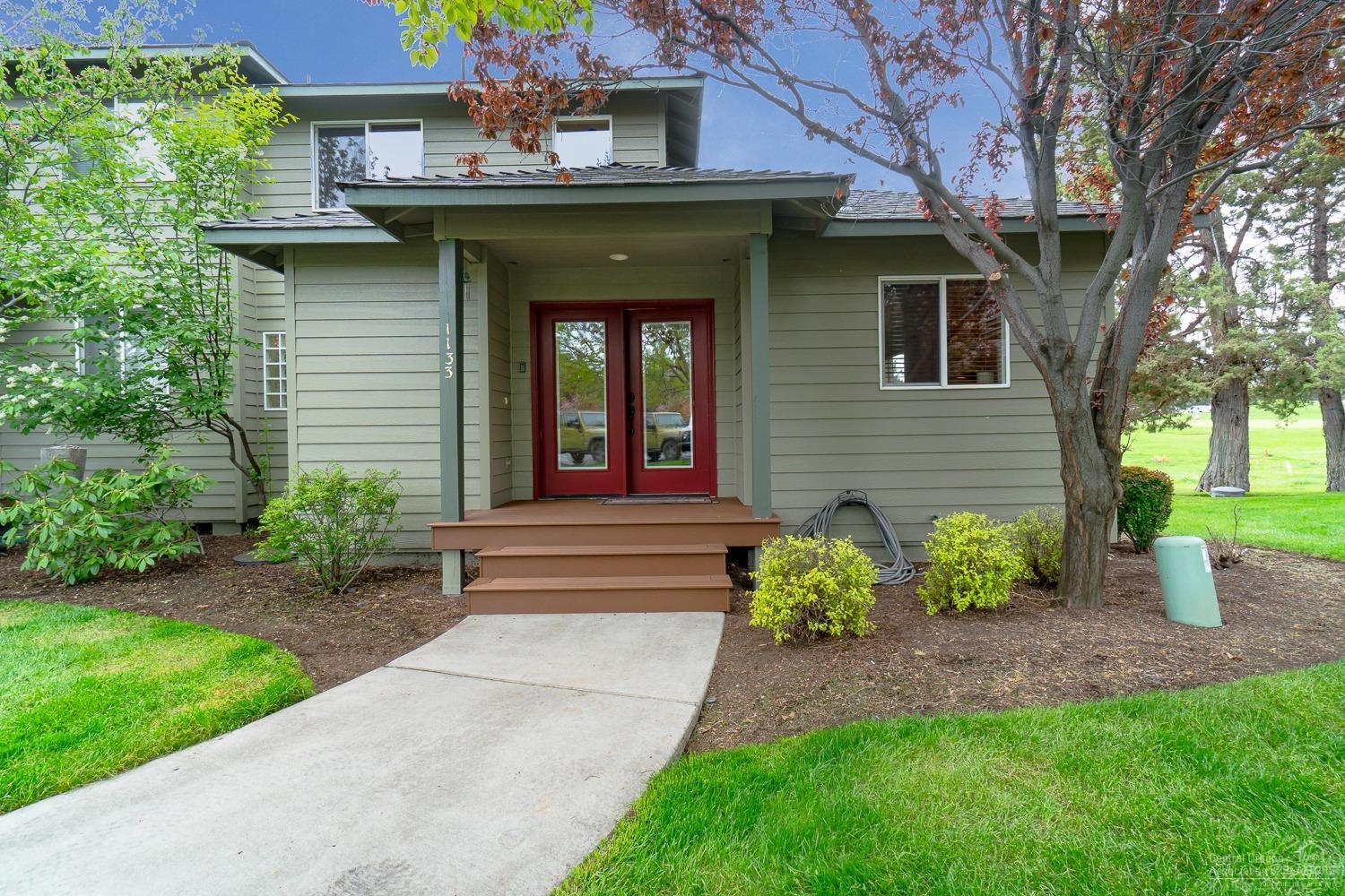 Exceptional remodeled townhome. This home features, Bamboo floors, new large windows facing 9th fairway & green of the Ridge Golf Course, refaced stone fireplace, expanded granite bar, remodeled master bath. This home is amazing! The newly trexed deck with hot tub overlooks the pond with overhead awning. Enjoy Eagle Crest Amenities.