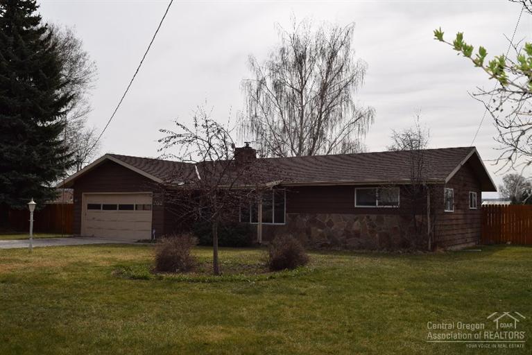 Country living at it's Best, 1 acre 7/10th irrigated with OID, 2 bedroom, 1 bath, attached 2 car garage, nice patio in a great location. Updates include pump on well. Great large storage shed, Metal Pole Barn, Pie Cherry and Apple trees along with nice landscaping including roses and lilacs. Riding Lawn Mower is an added bonus.