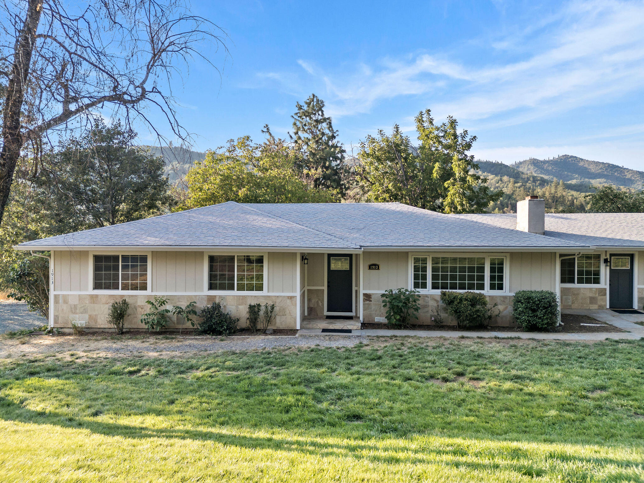 This 2110 sq ft, 5 Bedroom and 3 full Bathroom home on 4.54 fenced and cross fenced acres is nestled just outside of the city of Rogue River and centrally located between Medford and Grants Pass. Enjoy Rural living with the luxury of high speed internet. The property is all useable with lush pastures that make it perfect for Gardening, Horses, 4-H or a Hobby farm. Split floor plan allows for many options; Multi-gen living or possible rental opportunity. Cozy up by the wood burning fireplace in the Family room while taking in the mountain views. The Kitchen has an abundance of cabinets, stainless appliances and a gas stove-top. Recent updates include: Interior and Exterior Paint, HVAC system, Flooring throughout: LVP in main living areas and carpet in 3 of the bedrooms, Front doors, Bathroom vanities and toilets. Exterior features include 3 car garage with an area for a workshop, large Barn, Fruit trees, high producing well with new well pump, and space for RV parking and all your toys