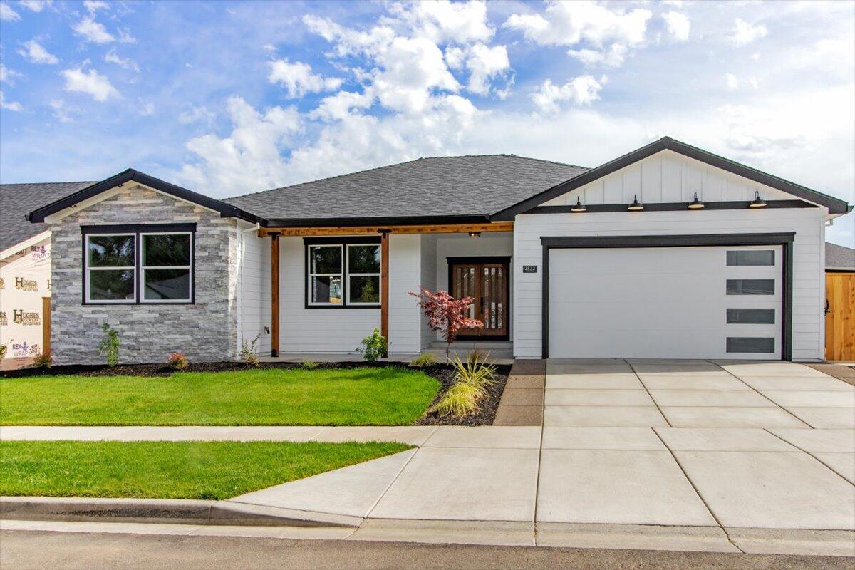 This urban farmhouse is custom built by Galpin Homes in the Cedar Landing Community, located at the foothills of Roxy Ann.  City park, trails, dog park and micro restaurants (coming soon) are all nestled within this vibrant neighborhood. This  3/2 open floor plan boasts many upgrades.  Contemporary lighting, waterproof laminate flooring throughout, granite countertops,  Large kitchen island and walk in pantry, contemporary linear electric fireplace with beautiful rock surround.  Primary bedroom has ensuite bathroom with beautifully tiled walk in shower, heated towel bars and walk in closet.  Fully landscaped and fenced!  A beautiful mix of modern and traditional touches make this a must see custom home!  Come Home to Quality!  



One year Galpin Homes, Builder Warranty included.