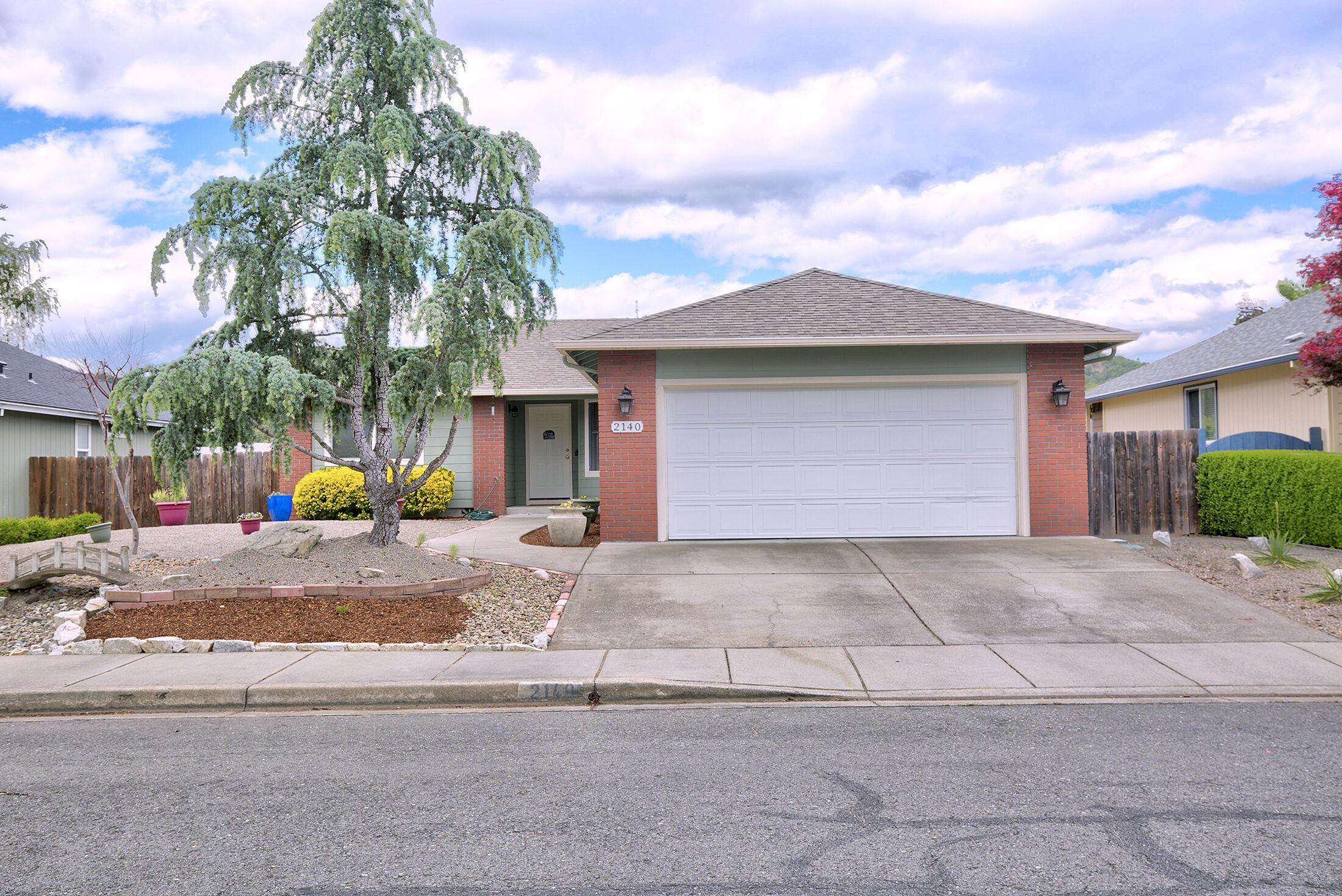 Neat as a pin!  Pride of Ownership shows in this lovely 3 bedroom 2 bathroom 1312sq ft. Built 1999, updated with carpet and paint!  Open & desirable split floor plan.   Light and bright kitchen with great counter and cabinet space!  Dining area is open to kitchen and  laundry room.  large living room with French doors out to covered deck!  Two guest bedrooms separated by guest bathroom.  Nice sized Master bedroom and master bathroom!  Back yard is fully fenced, two round raised garden beds with producing Cherry tree centered in each one perfect for adding more veggies or flowers to!  A great garden shed for all your goodies!  Two car garage. Easy care landscaping in front yard leaves you with extra time! On a level .18ac near end of rd. privacy. Schedule your tour today!