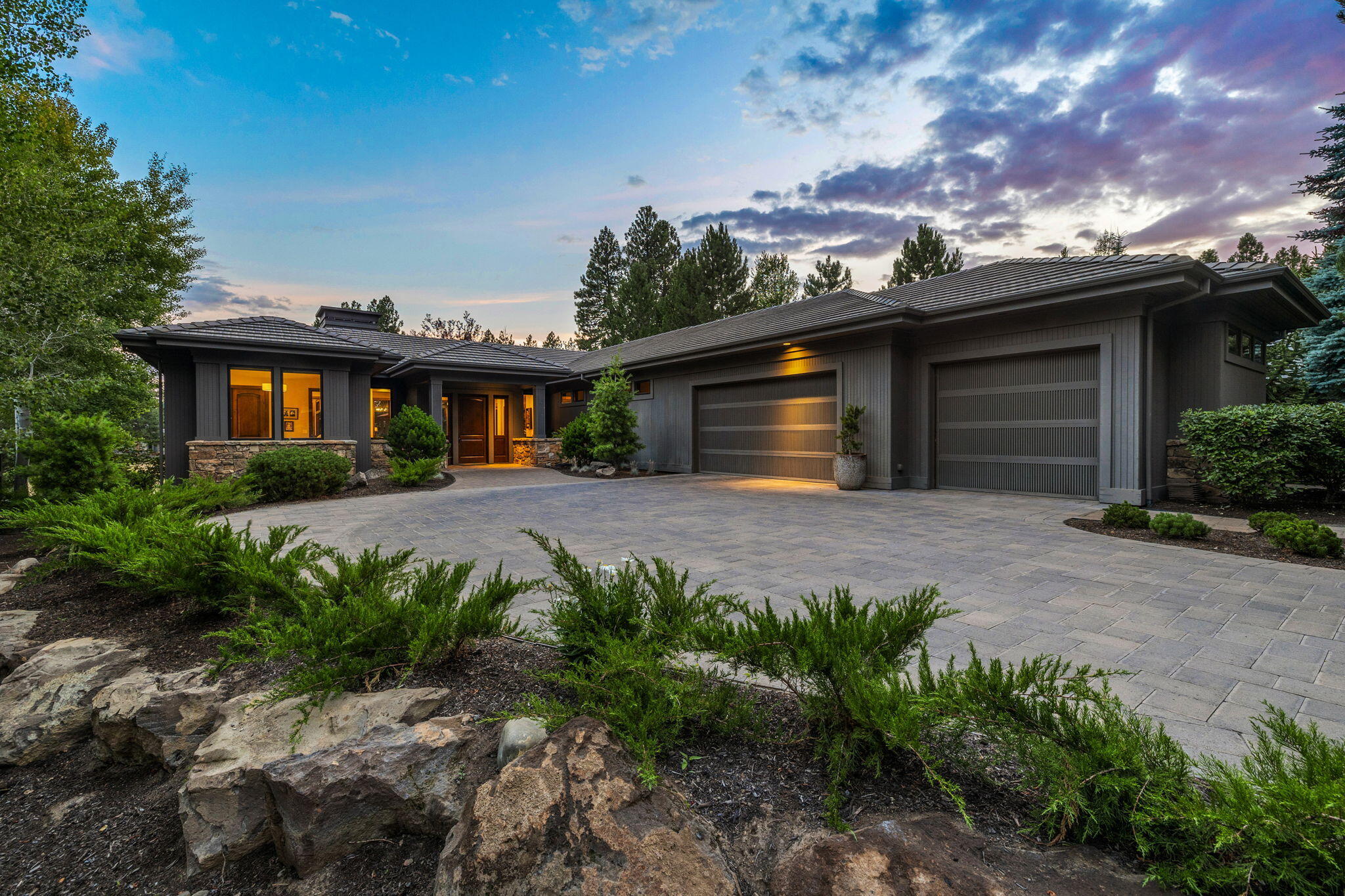 Pristine, newly updated, single level Broken Top home takes in sweeping views of the 17th fairway and glistening pond. This elegant home offers a flowing layout, designed for entertaining and an ideal separation of living spaces. Welcoming foyer opens to spacious great room, w/ windows framing the views and providing the perfect fusion of sophistication and warm ambiance with its Montana mossy rock wall encompassing the fireplace, wood flooring, custom lighting, fresh paint & clean lines. Kitchen features updated SS Dacor fridge, oven, microwave, Wolf cooktop, island, brkfst bar, desk & pantry. Beautiful dining area is cozy, yet spacious enough for hosting gatherings. Tranquil primary suite overlooks the views & provides a peaceful retreat for relaxing in front of the fire. Separate secondary primary suite provides well-appointed and private accommodations for guests. Addtl bedroom is located in separate wing of home, along w/ a spacious den/family room overlooking the stunning views.