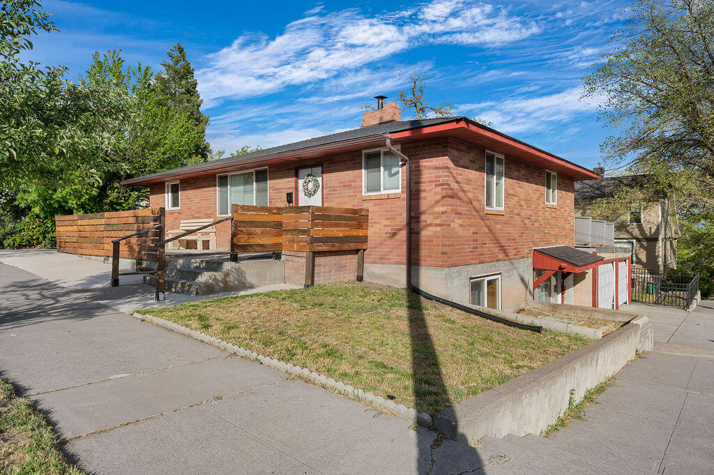 This charming brick home in downtown Klamath Falls offers incredible potential for multi-family living or rental income. With 5 spacious bedrooms and 2 bathrooms, the property is currently configured with separate kitchens and bathrooms on both the upstairs and downstairs levels, each with its own private entrance. The newly renovated kitchen upstairs features modern finishes, and the home boasts durable laminate flooring throughout for easy maintenance. With the addition of a separate power meter, this property can easily be transformed into a duplex or multi-family home. The upstairs also includes an ADA-compliant bathroom for added accessibility. Just steps from downtown, this property is a fantastic investment opportunity or a great home for someone looking for flexible living spaces.