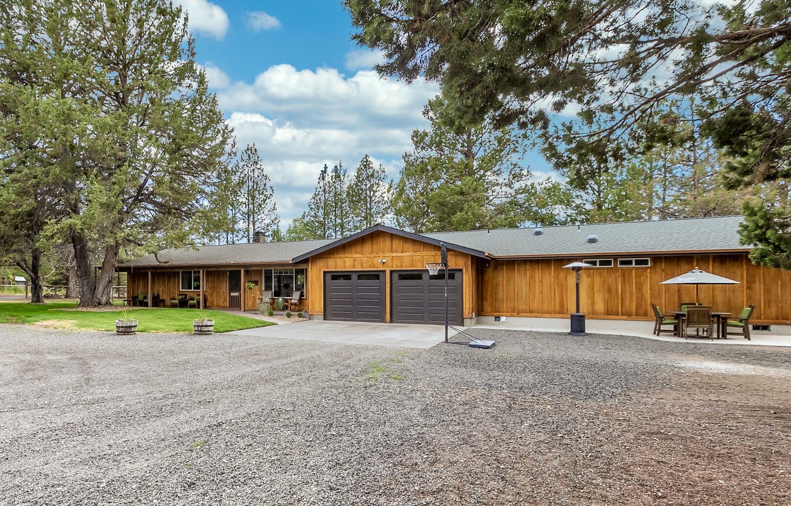 Rare, West Tumalo, extensively remodeled, single-level home! This immaculate home includes vaulted ceilings, exposed beams, updated kitchen & bathrooms. Home ALSO features a recent addition with a separate lavish master suite (2 master suites total). The new space could also be used for a bonus/family room or mother-in-law quarters if desired. This fully fenced small acreage includes irrigation rights & equipment, detached shop or 2nd garage and animal stalls & pasture. All this is less than 2 miles from Tumalo State park, Deschutes River, the Bite & downtown Tumalo. Only 5 miles to Shevlin Park or 8 miles to downtown Bend! New cedar & Breckenridge siding, new paint & stain, newer roof, flooring, lighting & kitchen... really everything has been updated! Also recent water heater, heat pump & drain field. Come visit this quaint Tumalo farm today! Peek-a-boo Mtn views