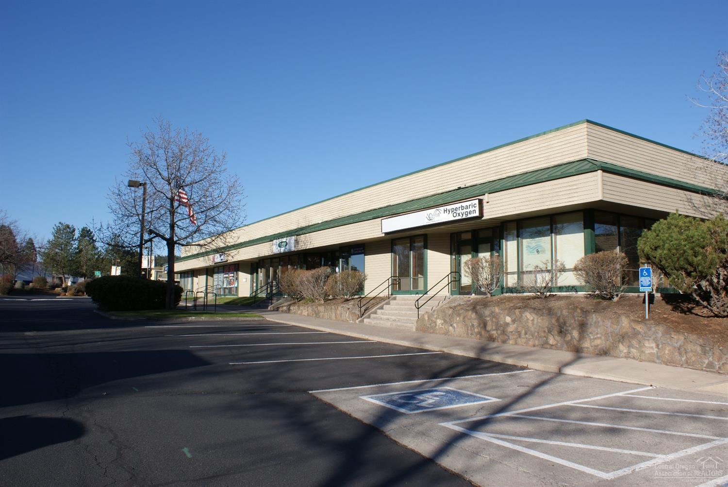 Building totals 53,877 square feet of rentable area with 37 suites and has Hwy 97 frontage. Block construction with framed frontage allows a variety of uses. Single entry fronts with several suits have double door entry and/or roll up doors to the back parking area.