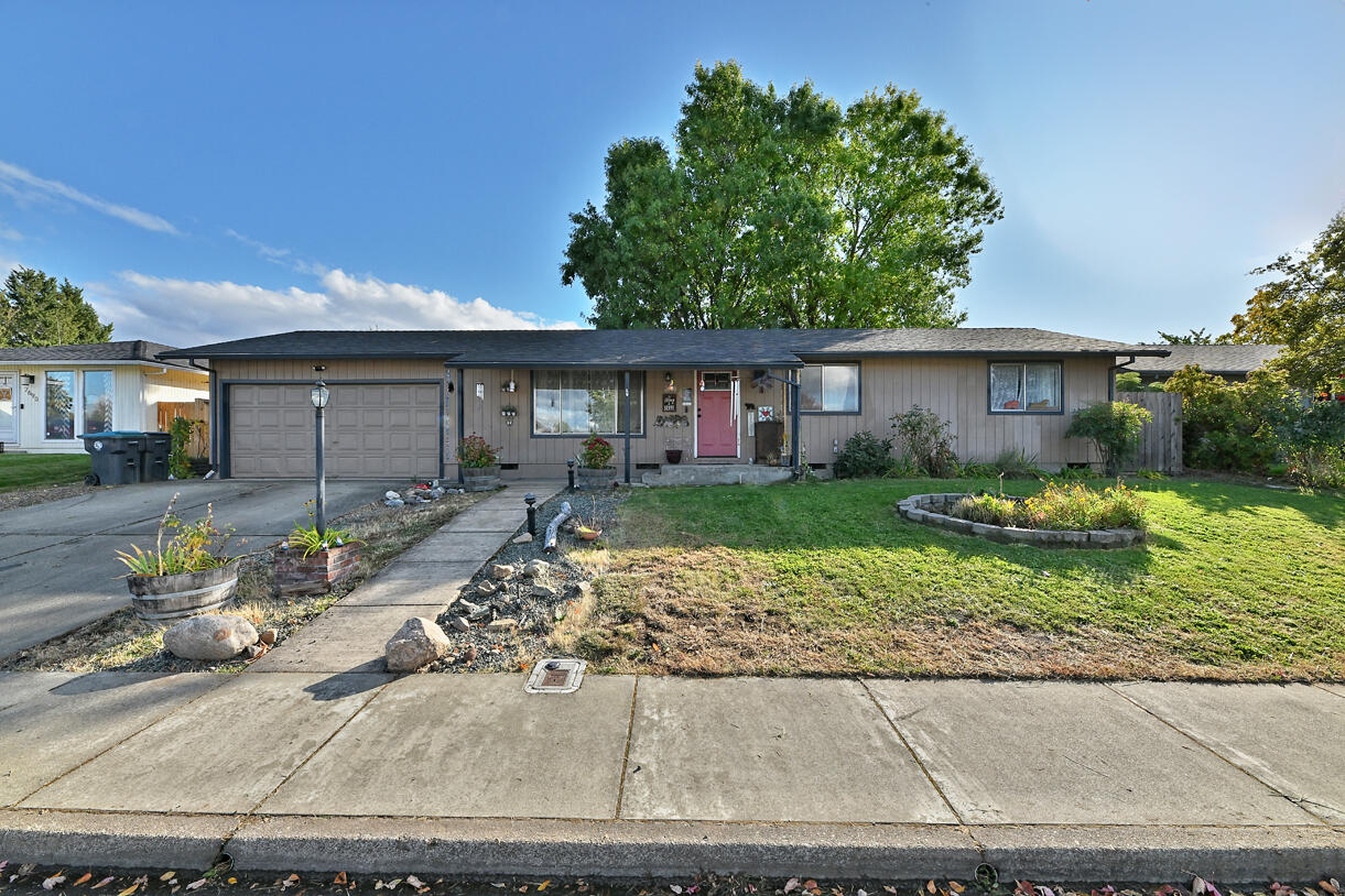Welcome to this beautifully updated home, designed for comfort and style. Large windows fill the space with natural light, highlighting the mature trees and thoughtfully landscaped surroundings. The charming back patio is perfect for outdoor relaxation, and the spacious garage and additional storage areas provide plenty of room for all your needs. Recent upgrades include a 40-year roof installed in 2017, a new waterproof floating floor throughout, a professionally installed heat pump, a new water heater with overflow filter and earthquake straps, a new overhead microwave, and a new dishwasher. Both bathrooms feature updated vanities and ADA-approved toilets, ensuring a blend of functionality and modern convenience in every detail.