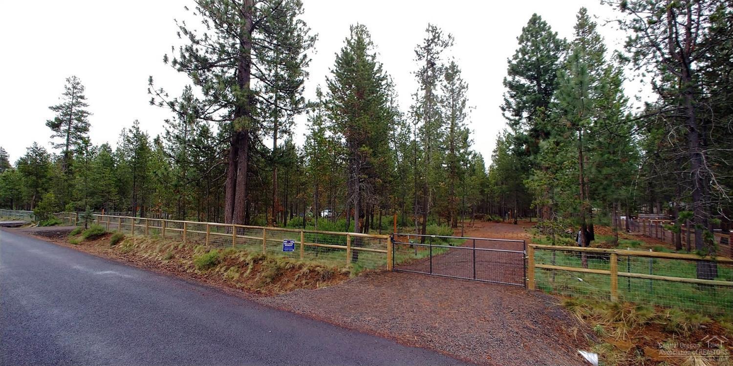 Ready to build on this developed 1 Acre Sunriver/Three Rivers South Lot on Paved Rd. w/175' of paved road frontage and 250' of depth fenced w/2 gates. Power installed w/electrical panel for home, irrigation, etc. & RV hook-up panel. New Sand filter septic enrolled in environmental monitoring prog. & ready for a home. New well installed w/irrigation back-flow & set up to be able to winterize irrigation and house (when built).Grounded blue wire laid along side buried water & electrical lines for easy identification from surface. Electrical outlet to fence for Lights etc. 2 locations for irrigation (water & outlets) Electrical panel for Garage and home ( ready for RV to plug in now ). Just South of Spring River Rd. down the street from the resort at Sunriver & Crosswater. Close to the Big Deschutes River and Community Private Boat Launch/Park. Minutes from Forest Public Lands, and about 15 minutes to Mt. Bachelor. Community has boat ramp to Deschutes. Ready for your dream home.