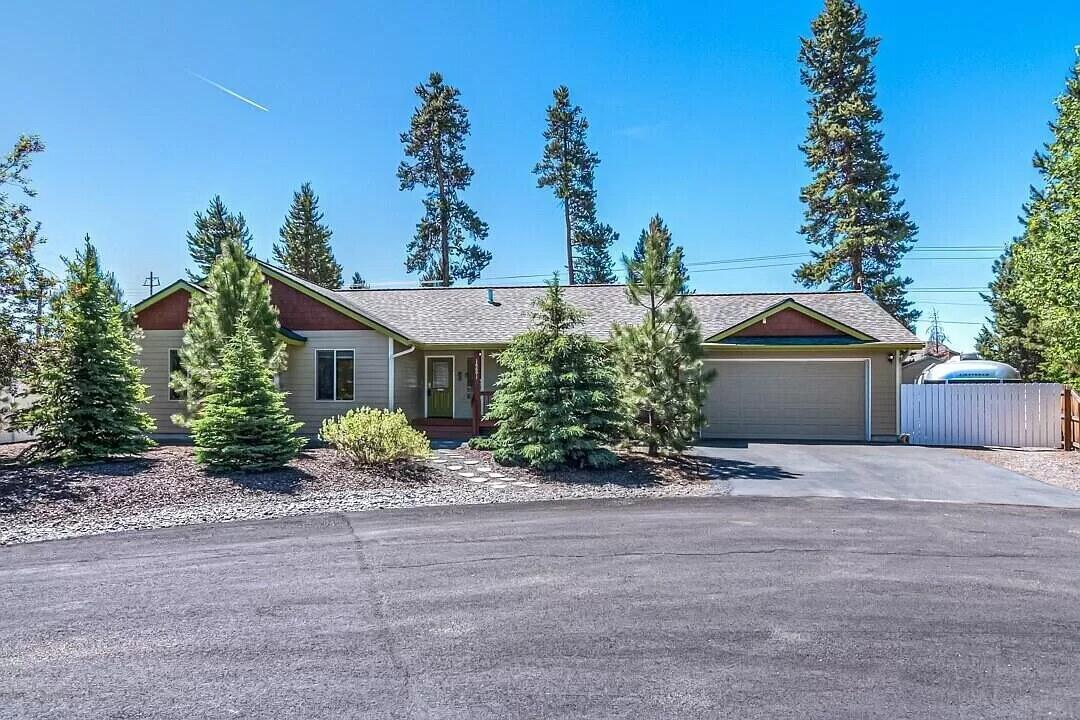 Nestled in a quiet La Pine neighborhood just off Hwy 97, this well-maintained 3-bed, 2-bath home offers privacy with convenience. Features include refinished hardwood floors, a new roof (2021), vaulted ceilings, and a natural gas fireplace. The upgraded kitchen boasts hickory cabinets, granite counters, a gas range, and convection microwave. Spa-style baths feature a steam shower in the primary suite & a jet tub in the guest bath. Enjoy a fully fenced, landscaped backyard w/ outdoor bar, RV/Boat parking, garage, & shed. Sidewalks, nearby trails, park access, & Paulina Peak views complete this Central Oregon retreat. Conveniently close to local dining, coffee, & everyday amenities, this location places Central Oregon's outdoor lifestyle right at your doorstep—enjoy nearby hiking & biking in the Deschutes National Forest, explore the Newberry National Volcanic Monument, & access the Deschutes River, Paulina Lake, East Lake, and Crane Prairie Reservoir for fishing, paddling, & boating.