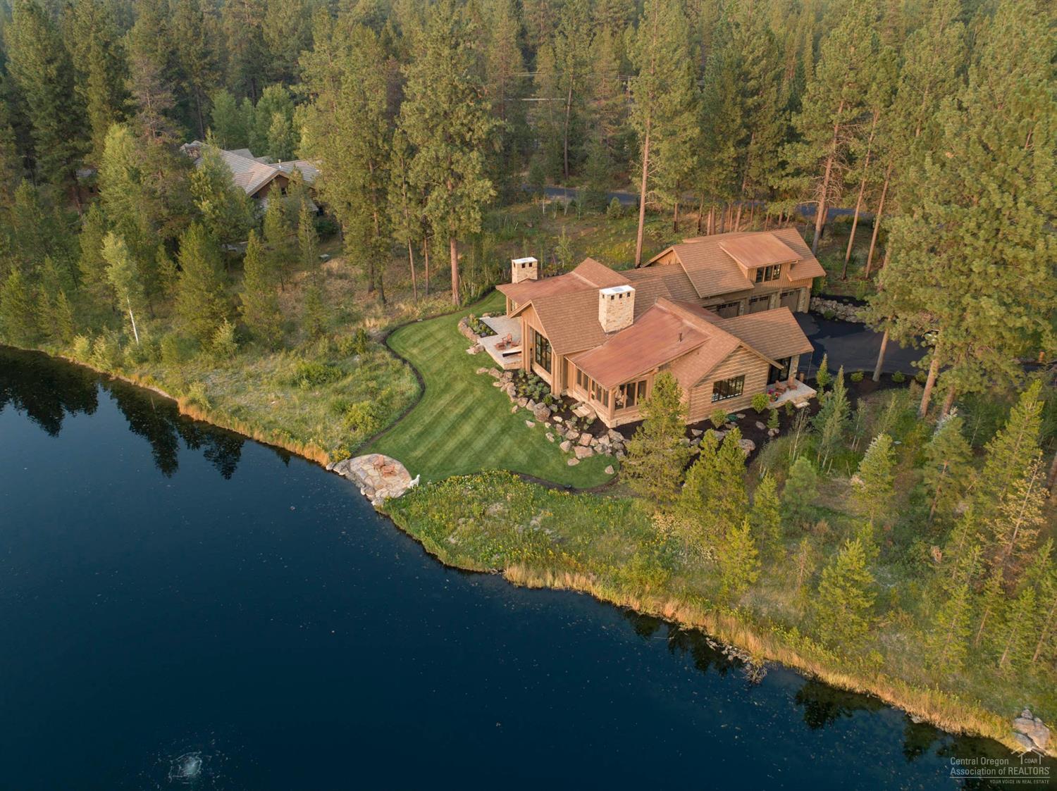 1.59 acres overlooking 3 acre Rainbow lake w/ impeccable attention to detail and unbelievable finishes throughout. Lake front w/ full Mt Bachelor views! This Jerry Locati designed custom home built by Sunridge Construction boasts a gourmet chef's kitchen complete w/ white honed oak cabinetry, an expansive stainless-steel island, 250 bottle air cooled wine cellar, an expansive master suite retreat w/ showstopping fireplace, spa-like bathroom w/ radiant heat floors, large walk-in shower & modern soaking tub overlooking the serene setting, multiple outdoor living spaces & outdoor fireplace, 1175 sq ft 3-car garage w/ dog bath and so much more. Truly leaves nothing to be desired! Vandevert Ranch is a gated community w/ 20 custom homesites on 430 acres only 30 minutes from Mt Bachelor. Enjoy fly fishing at the ranch on 1.5 miles of the Little Deschutes River, a 3 acre pond loaded w/ trout, walking trails throughout & a horse stable to keep your own horse.
