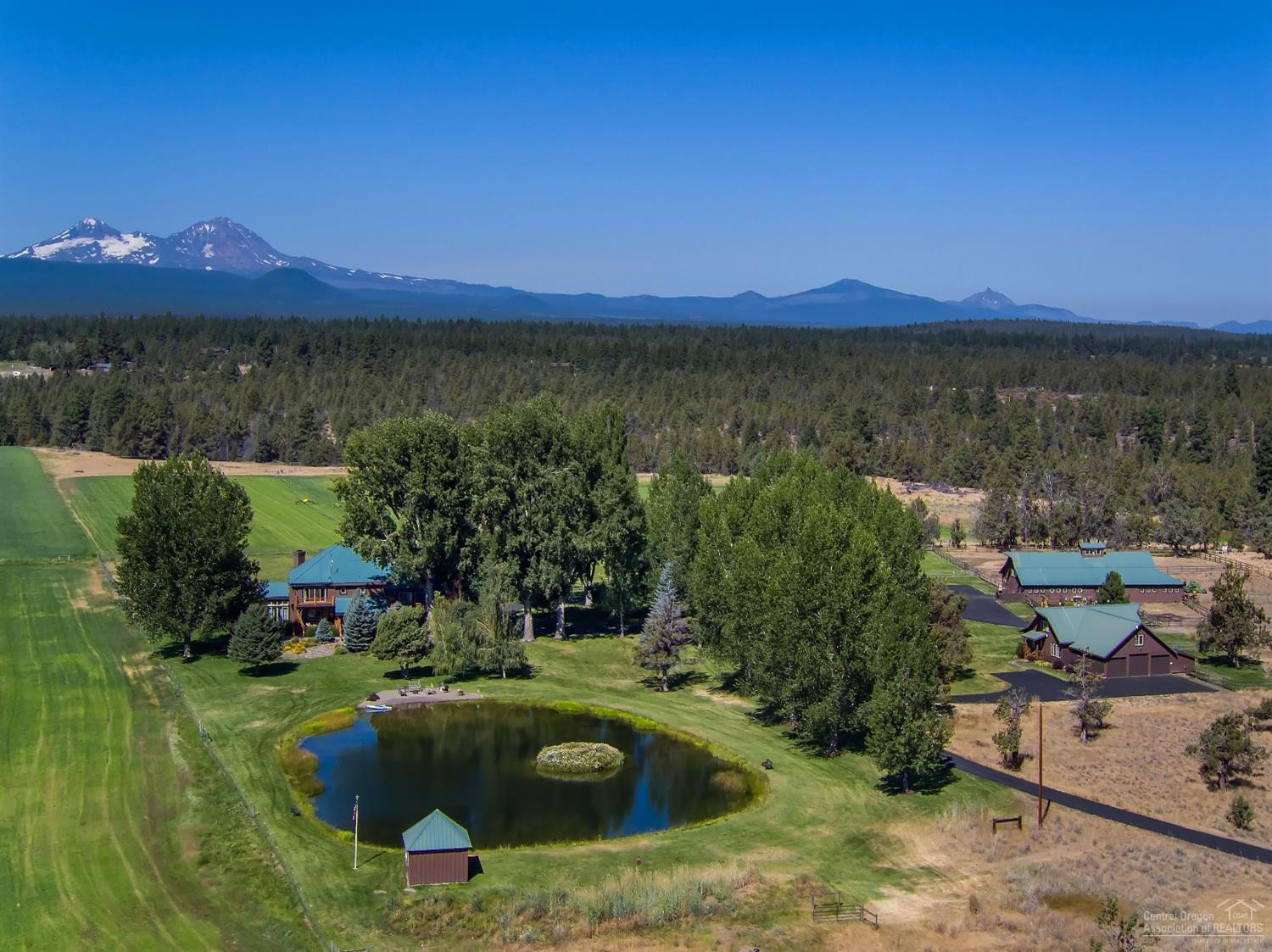 The Box S Ranch offers unmatched seclusion & privacy, 280 acres, Cascade Mt. views just 4 miles from Bend. Main Home: 4416 sf, 4 bed, 5.5 bath, office, formal dining room, gourmet kitchen, stone fireplace, decks, patios, 4 car garage. Property: 95 acres of water rights, varied topography, 2 Canyons, 2 stocked ponds, Perimeter Fenced, Gated Driveway, 1850 sf Guest Home, Barn with office & shop, Garden, 2 Hay Barns. Additional Building Sites. This ranch is one of a kind, Recreational Lifestyle Property!