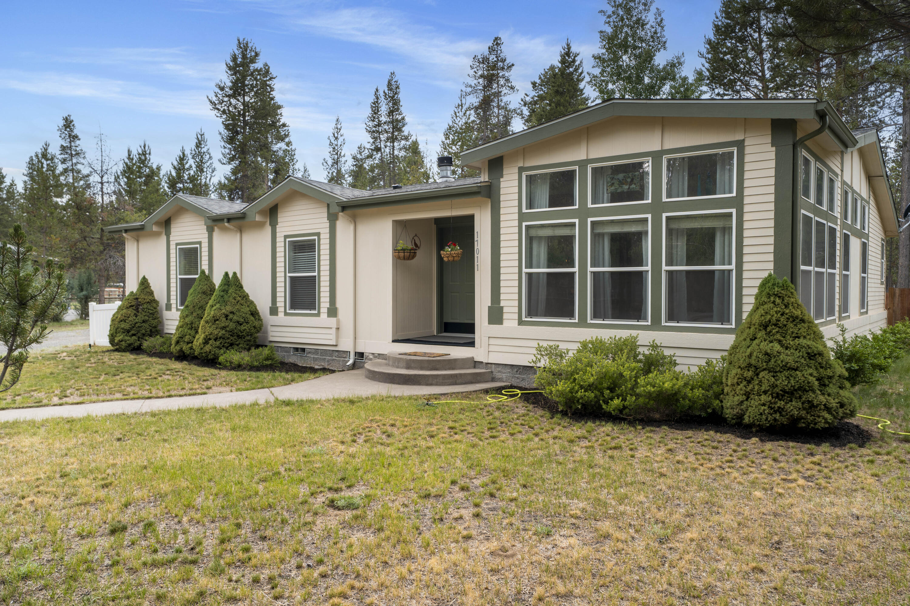 This 2,106 square foot Palmer Harbor home was built in 2003, but when you enter the home you would think it was built yesterday as it looks and feels ''brand new''.  The sellers have really maintained the home and the property, so when you come by you will appreciate the new kitchen counter tops and back splash, freshly painted exterior, newer flooring, the heat pump was installed in 2021 and there is so much natural lighting you won't feel the need to turn on light switches.  The outside patio is large enough so you will enjoy either entertaining friends and family or just go out and read a book in privacy. The over sized garage is 24' x 32' (768 sq. ft.) featuring plenty of room for your cars, work bench and toys, but if that is not enough there is also a 10' x 12' (120 sq. ft.) storage shed on the property too.  The electric bills average $151/month with a low of $110 and a high of $224.
