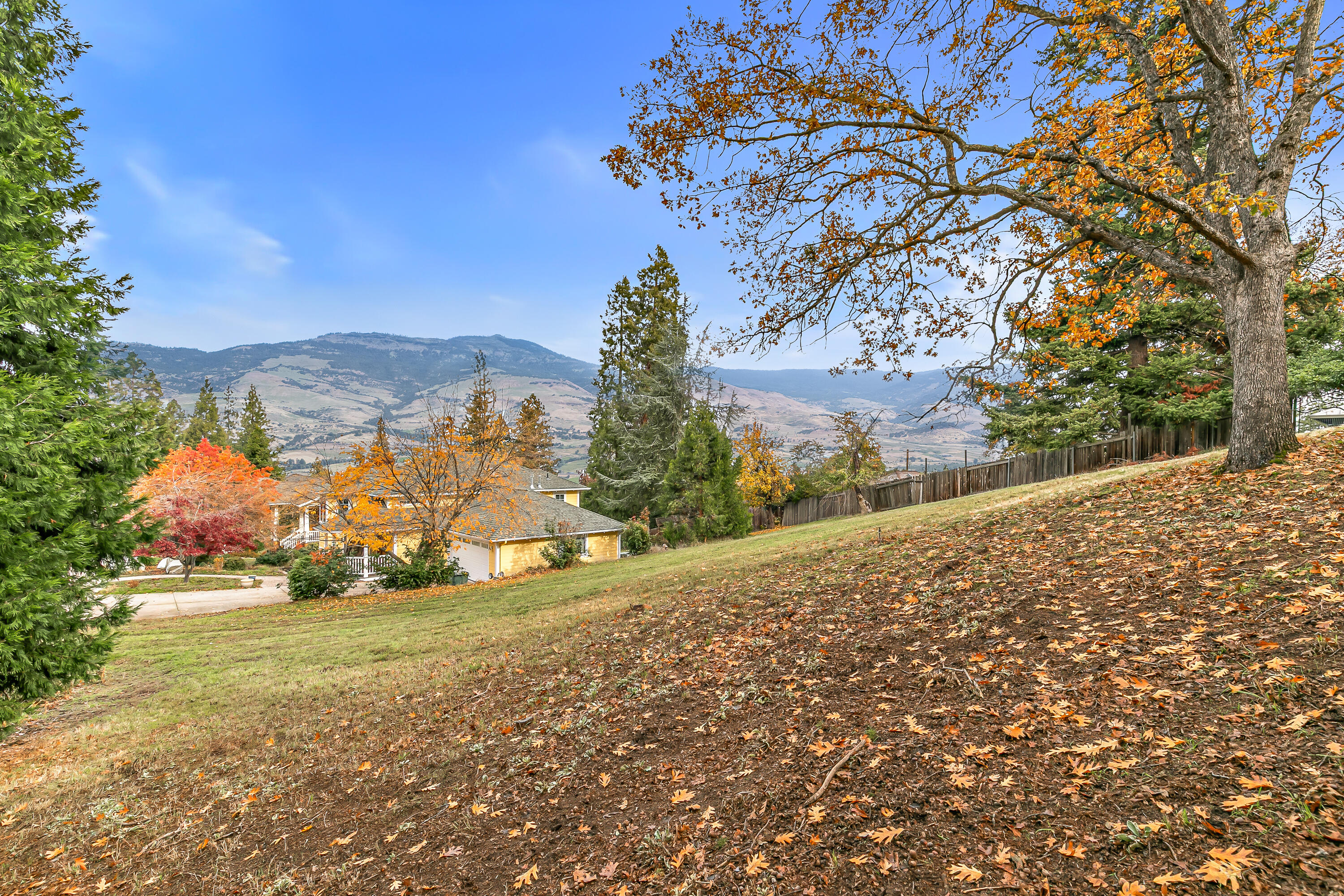 Last available view lot on Merril Circle bordering 0.41-acre community park, located above the boulevard within a half-mile of the Ashland Library! Property is gently sloped with a cleared and established building envelope, mature trees, and underground utilities in place. Desirable neighborhood of high-end homes with small association covering all common area maintenance and landscaping for the contiguous 0.41-acre park. Inquire with agents to access complete due diligence package with surveys, maps, disclosures, title information, and additional media!