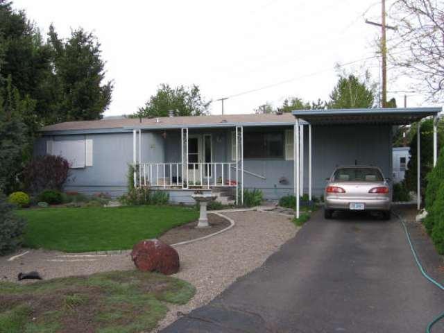 This Home Should Be In better Homes And Gardens! Don't Let The Age Fool You! Beautiful Berber Carpet, Custom Drapes In Livingroom, Upgraded Gas Furnace And A/C. Large Covered 10 X 46 Deck In Back, And Covered Front Deck Too! Largest Yard In Park Beautifully Landscaped. 2 Sheds And Full Fenced. Tastefully Decorated, Lots Of Storage, Garden Tub In Master Bath And More! Owner's Son Is House-sitting. Call Ken Wilson To Show At (541) 621-2577.