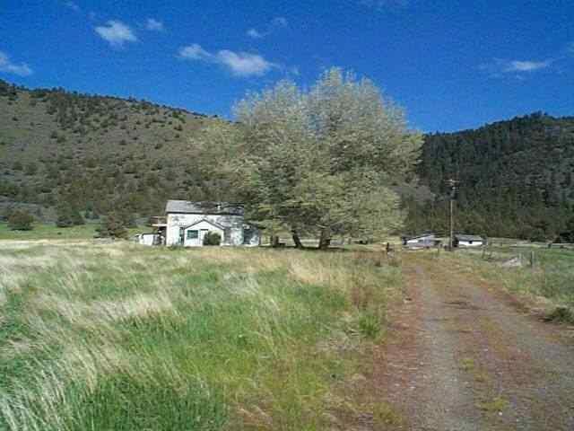 House Beyond Repair.Septic Sys.Needs Replaced Two Drilled Wells, One Of Which Puts Out Over 300 Gallons Per Minute. Good Grazing Land. Fenced. Seasonal Creek. Border By Us On E. View. Located Between Mile Post 254 And 255.