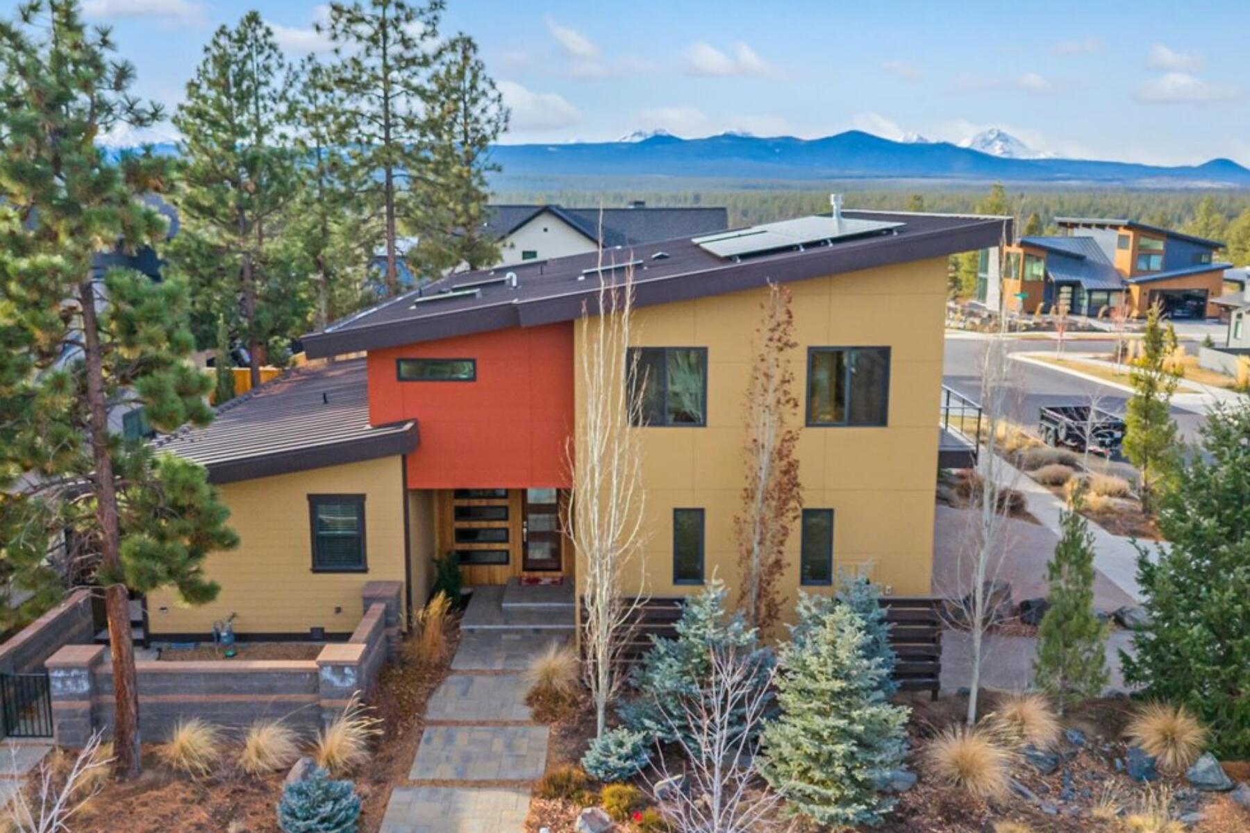 Experience contemporary luxury living with this exceptional custom westside home on a corner lot, a rare find, with attached 1-bedroom apartment, shop and rv/van garage. Designed to maximize the breathtaking Cascade Mountain views this light and bright home celebrates Central Oregon living, where luxury, sustainability, and panoramic views converge to create an unparalleled living experience. The finish work on this home is spectacular, craftsman woodworking, hardwoods throughout and custom tile work. Versatile features of this home are its  two-car garage with separate van/RV garage, and workshop with roll up doors. Additionally, the attached one-bedroom ADU offers flexibility for guests or rental income. To top it off this Earth Advantage Platinum home embraces sustainability with an energy efficiency rating of 10. Outside, the fenced xeriscaped yard offers a low-maintenance retreat, perfectly complementing the sleek architectural lines of the home.