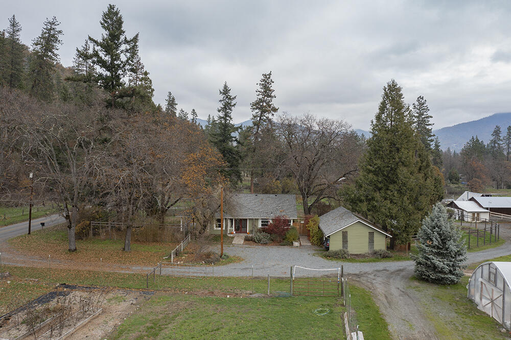 Located in the beautiful Applegate Valley * TWO HOMES on one tax lot! This farm is set up for your agricultural needs. With EFU zoning & IRRIGATION RIGHTS on 21+ acres to Thompson creek which is on the property, 2 reservoirs for upper fields & 8 holding tanks also. This property backs up to BLM land. With added bonus of  3 wells (GPM done on 12/14/20)  & 3 septic's (pumped on 12/12/20) The farmhouse has been updated with new  kitchen floors & appliances with complety fenced in back yard and new deck, great views of the property also. The ADU 2,153 sq. ft. is a custom built straw bale home with a  
 beautiful soap stone stove a very unique design. Would make a great Air B&B or rental has it own separate driveway also with fenced in back yard, great horse property  also features, green houses ,guest cottage, barns, Orchard. Property is fenced with multiple pastures. Close to a lake, rivers, vineyards. PLEASE watch video. So much to see & offer on this property its a MUST see!