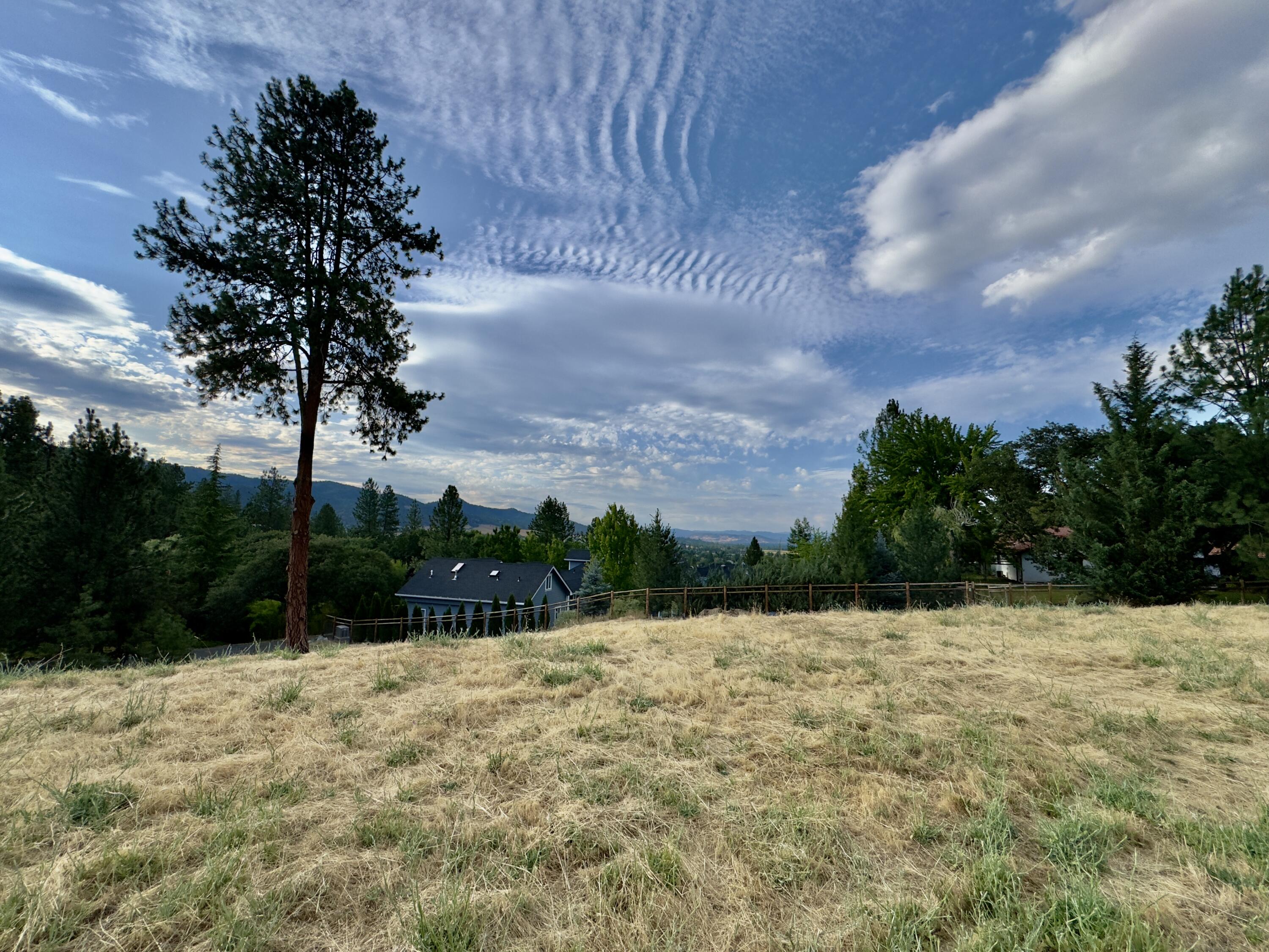 Here's your chance to build the home of your dreams in one of Jacksonville's most desirable neighborhoods. This exceptional .61-acre lot sits on a quiet private lane in the prestigious Westview Heights community, surrounded by luxury homes and offering sweeping views of the Table Rocks, Rogue Valley, and city lights.

Enjoy both privacy and convenience—just minutes from historic downtown Jacksonville's charming restaurants, boutique shops, wine tasting rooms, hiking trails, and the beloved Britt Music Festival.

City services including water, sewer, natural gas, and cable are available & this lot is also a short drive to top medical centers & the airport.

Picture sipping wine on your future porch as the sun dips behind the mountains, or entertaining with the valley twinkling below. Whether you're ready to build or planning ahead, this breathtaking property offers the perfect blend of beauty, location, and lifestyle. Bring your visions and your dreams for a peaceful lifestyle.