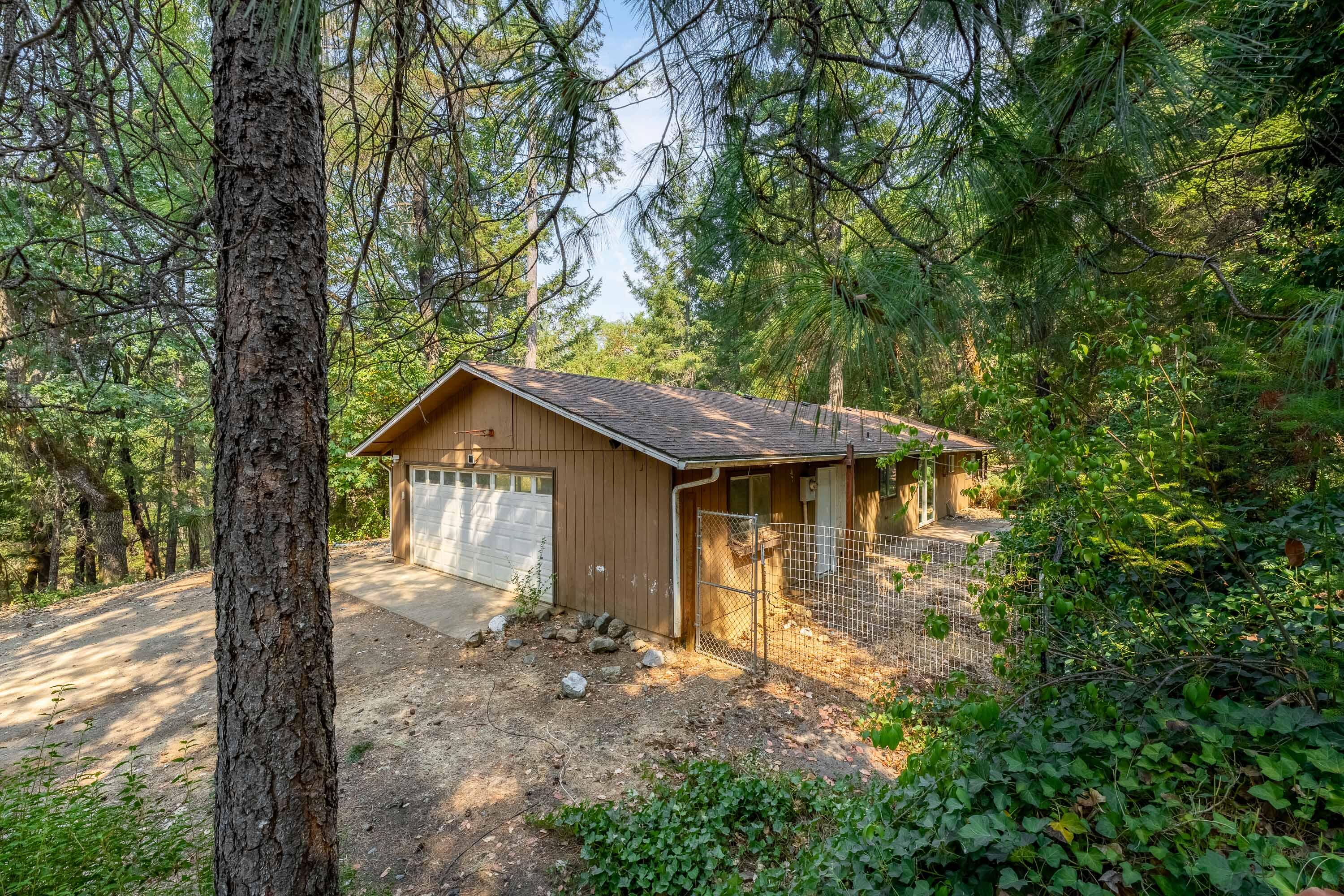 Discover the potential at 145 Ingalls Ln! This 3-bedroom, 2-bath home sits on 5.14 peaceful acres in a private treed setting. The property offers an attached 2-car garage and plenty of space for your vision. With some TLC, this home could truly shine—whether you're looking for a private retreat or a place to build equity. Bring your ideas and make this property your own! Buyer ti be responsible for their own due diligence.