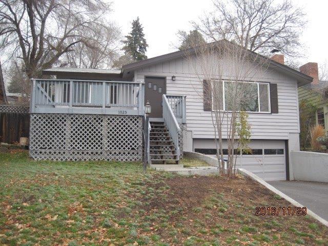 Super cute updated home on Pacific Terrace! Split level 3 bedroom, 3 bathroom house with finished basement. Large living room open to the dining room with newer laminate wood flooring and white brick fireplace. The interior has been freshly painted and both bathrooms updated with a newer vanity and vinyl flooring. The kitchen has been updated with modern white cabinetry, nice backsplash, and appliances, along with vinyl flooring. Downstairs is the third bedroom with a large family room and third bathroom with laundry room area. The home shares two entrances to the house from the garage where there is a nice workshop area and central vacuum system. Off the kitchen is a large fenced yard with back deck for barbequing with gated access to the back alley.