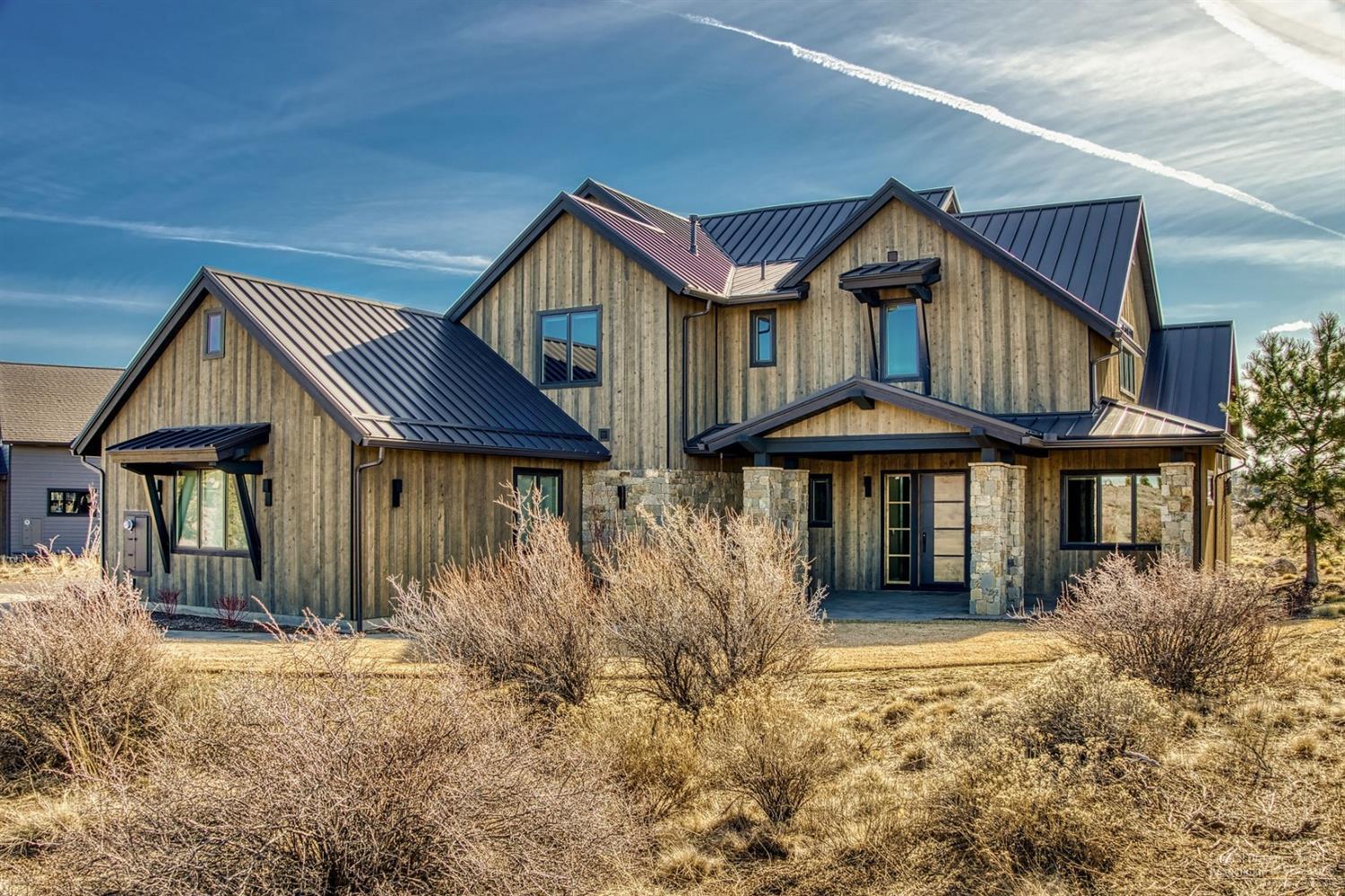 Stunning southern views across the well established neighborhood in Tetherow and Tartan Druim. Situated .64 of an acre, this custom Northwest contemporary 4,348 sf home features the master bedroom, office with a closet, kitchen/dining, half bath, large utility room w/sink & 3 car garage on the main level. Second master suite, 2 additional en-suites, bonus media room upstairs. Luxurious updates include; state of the art home audio system throughout, automatic blinds w/ remote access, custom cabinetry in all closets & pantry, double walled plumbing on 2nd floor for soundproofing, soundproofing insulation from media room to interior walls of the home, alarm system, central vacuum, metal roof, fire pit, extended second floor patio. Home to be sold mostly furnished! This is a must see property!