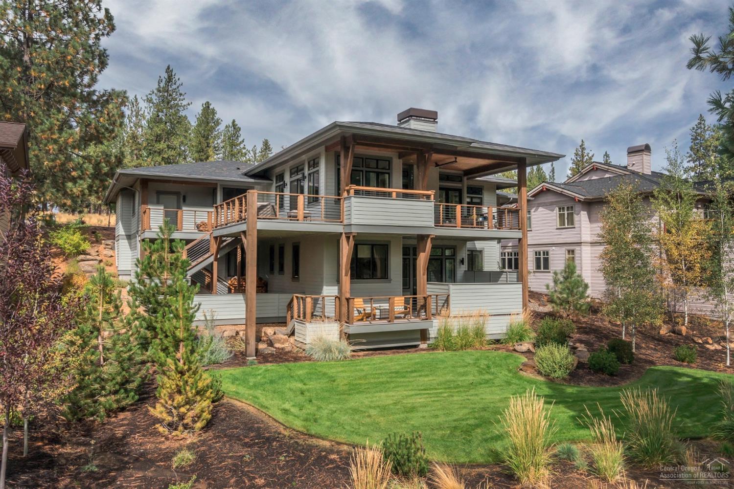 Stylish simplicity in this timeless yet contemporary, lightly lived-in NW Bend custom home. High ceilings, transom windows, open floor plan & easily merged indoor/outdoor living. Stylish white kitchen w/ shaker style cabinetry, subway tile backsplash, SS appliances, farm house sink & barn door leading to Lg pantry. Perfect for family w/ 4BD, Office, Family Rm, 2 huge Bonus Rms & dog run. Backs to trail system leading to Phil's Trail. Bike/ski from your backyard & be in Nat'l Forest in 15 min.!