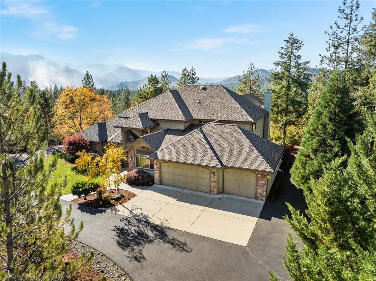 Beautifully manicured private estate.  Gated paved driveway gently winds up the knoll to a majestic 3,503sf home w/2BD and 2.5 BAs. Add'l Ofc & Bonus area could be turned into a 3rd BD-- Septic permit allows for 3BD. Open floor plan w/separate living & dining rooms. Visually pleasing staircase takes you to the 2ndBD, bonus area, full BA & balcony w/majestic mountain & SW facing views! Primary BD has door to covered shared patio, room for LG furniture, primary BA has LG walk-in closet, walk-in tile shower, LG bathtub spa, dual sinks, sep toilet area. 3 car garage. Room for RV pkg/gardening/pets/animals. Property is sloping w/flat areas. Second buildable lot can be sold separately to ensure future privacy. Ask agent for more. Home & property have too much to list here so ask for the Feature/Good-to-Know List & video loaded in MLS! Or if this is being viewed by other websites go to //clients.wcimages (insert dotcom) /596-Bellewood-Dr/idx  to see video and lists. Contact agent today!
