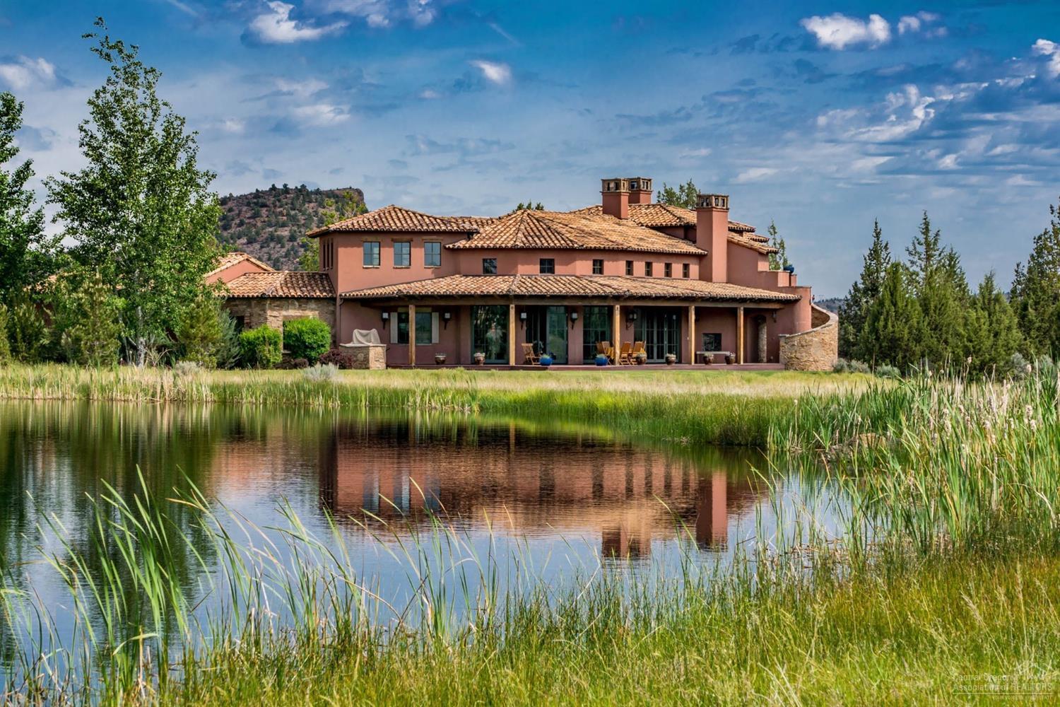Live the life you've always imagined in this striking Tuscan estate in Ranch at the Canyons. Built w/ integrity to encompass dramatic views of the Cascades, Smith Rocks & 1700 acres of surrounding ranch. Utmost care was taken during the building process w/custom stone & wood detailing. The home possesses a plethora of impressive features. Generous wrap around porch, regal master suites, jaw dropping kitchen. New driveway, entrance & landscape. Lavender just harvested. Stables, vineyard, club house, river.