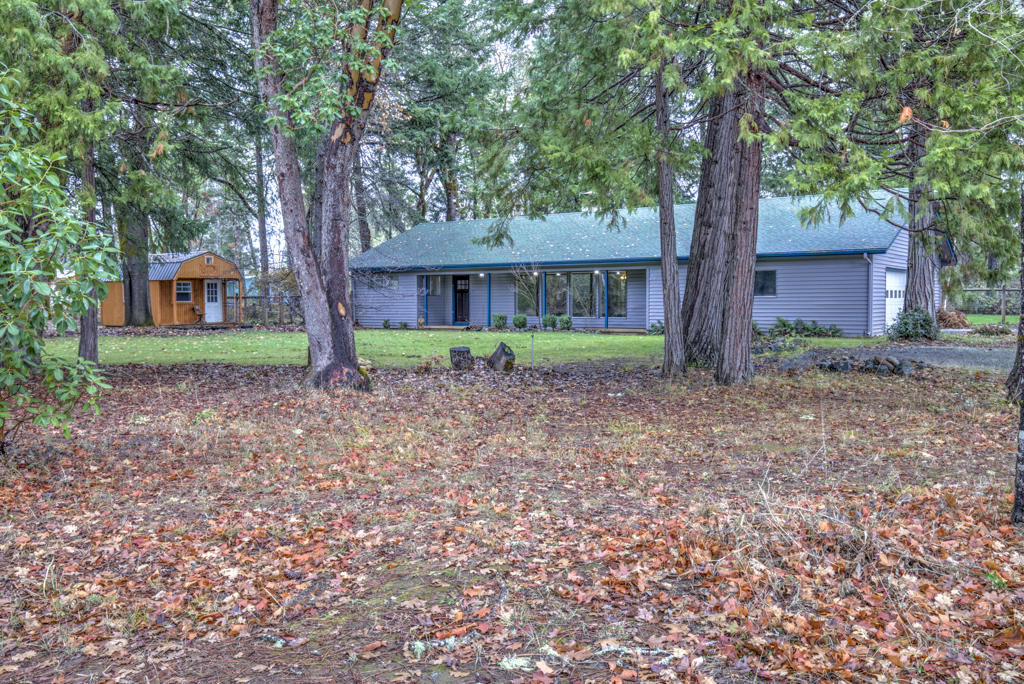 Rural living on 5 usable acres in this spacious and recently renovated 3 Bd 2 bath Home. Featuring a double sided fireplace that has had the spark screen replaced and chimney cleaned last winter. The home is equip with 4 newer ductless heating units and nearly new appliances. The roof was replaced in 2014 and has been treated and cleaned this year. New hot water heater and much more care and maintenance has been completed on the home and on the property. There is an additional detached office or storage shed. Fenced and raised garden beds with plumbing and timers, back yard cross fencing, gazebo with a wood deck and even a chicken coop area. Located approximately 40 minutes to Grants Pass and 60 minutes to the coast. This property is move in ready, all it needs is your personal touch to make it your home.