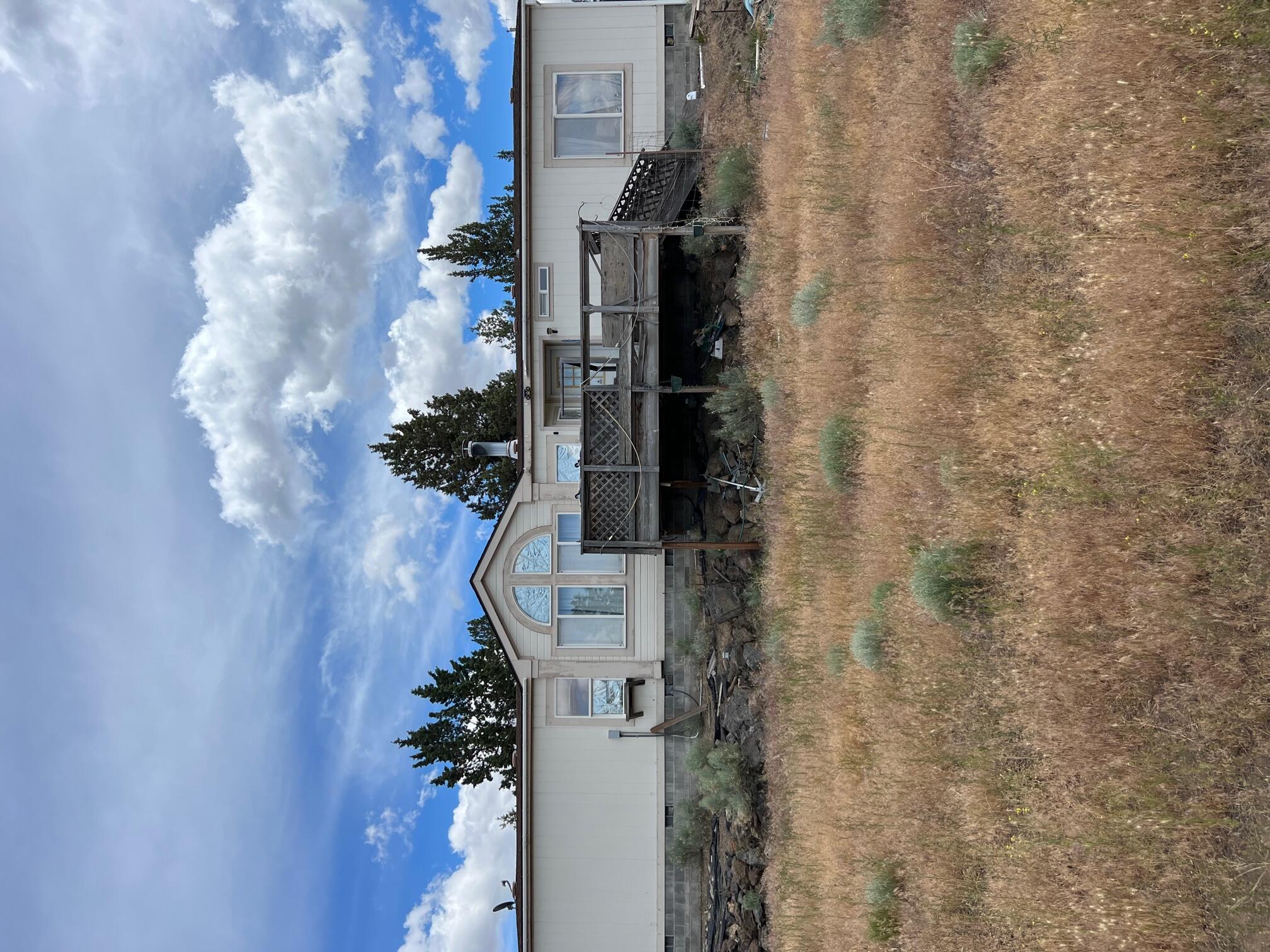 Outstanding location in Whispering Pines.  This property is situated on 2.61 acres between Bend and Redmond.  Enjoy Cascade Mountain sunsets while watching the local wildlife.  This property is a fixer.  Bring your imagination and make it yours!