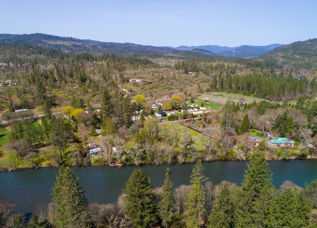 Shady Trails RV Park, gateway to the lakes and located on the beautiful Rogue River is now available. Property offers 57 camping locations, with 4 spots on the River. The entire 6.74 acres is irrigated and has two separate tax lots, zoned RR-5. Tax lot 2400 is .80 acre located on the river's edge, while tax lot 3009 is 5.94 acres with 53 camp spots along with the main house and 1 manufactured home that the owners live in. There are so many possibilities for this property. Each space is rented on a month to month contract. Rental receipts from August shows gross rents of 22,680.00. There is a full service laundry facility, shop with extra parking, vending machines and propane sales for the park.