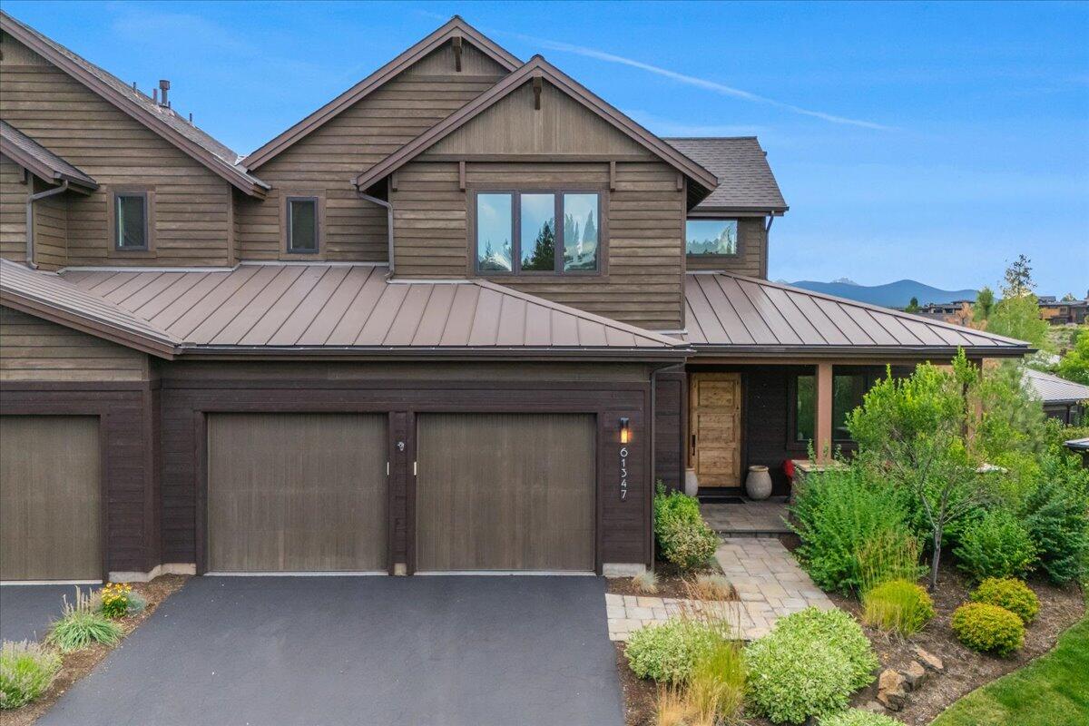 Beautifully appointed townhome at this coveted location in Tetherow! As one of the best situated Triple Knot homes, you will enjoy views of landscaped ponds, green space, and the Cascade Mountains. Inside and out, this home has been meticulously maintained by the original owners and is graced by generous windows, a tiled floor-to-ceiling fireplace, hardwoods and solid surfaces. The main floor living space boasts a beautiful great room with 13 foot ceilings, a chef's dream kitchen, private den/office, Primary Suite/bathroom, and a well-appointed mud/laundry room off of the two-car garage. Upstairs are two additional second-floor suites with the west-facing suite displaying epic mountain views. This home offers luxury living with HOA exterior care. Providing ample space to live out your dreams in Central Oregon whether it's a vacation home or your primary residence.