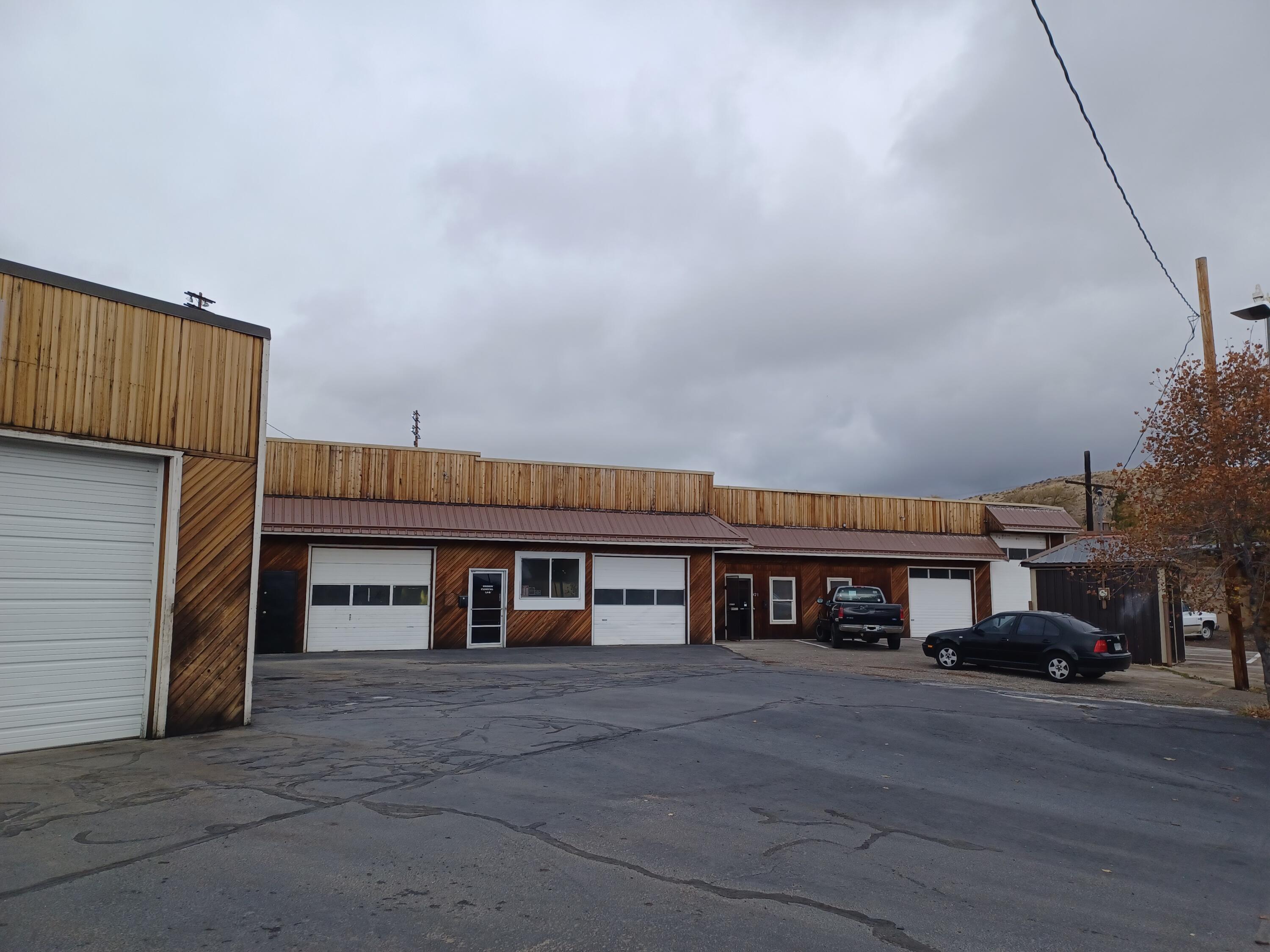 Commercial center with two buildings and off-street parking. Great location in high traffic area, near downtown Klamath Falls.Nice spaces with multipurpose use. Flexible renting spaces with the ability to adjust interior walls to accommodate needed space size makes the building easy to rent out. Rear building with 5 roll up doors and the ability to add two more. Three man door approx. 6,158 sq. ft. with additional storage loft space. Space A is apx. 3,400 sq. ft. with 2,400 sq. ft. storage loft. Large shop, 1/2 bath, and 2 each 9 ft. roll-up doors. Space B is 990 sq. ft. office showroom and shop space, 1 man door, 1 9ft. roll-up door. Space C is 2,368 sq. ft. with 800 sq. ft. storage loft. Showroom, office, 1/2 bath, shop sink and cabinets. Standalone building located on the corner of Esplanade and Spring St. has approx. 1,115 sq. ft. 2 each 9 ft. roll up doors, 1 man door, office, 1/2 bathroom. car lift, air compressor, storage/parts room. All 4 units currently rented.